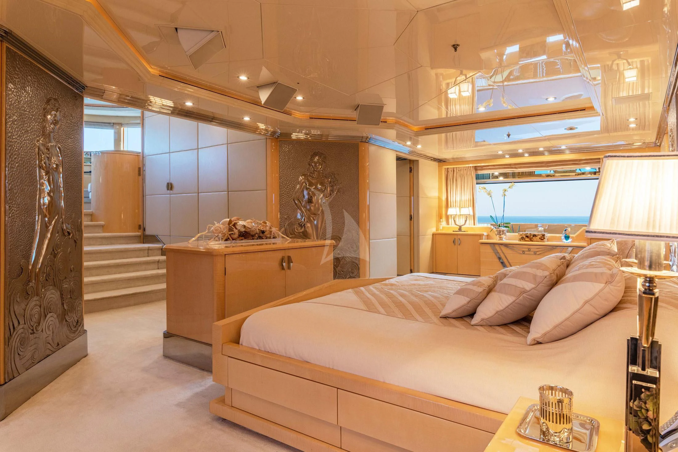 a large bedroom with a large bed aboard SUNDAY Yacht for Charter