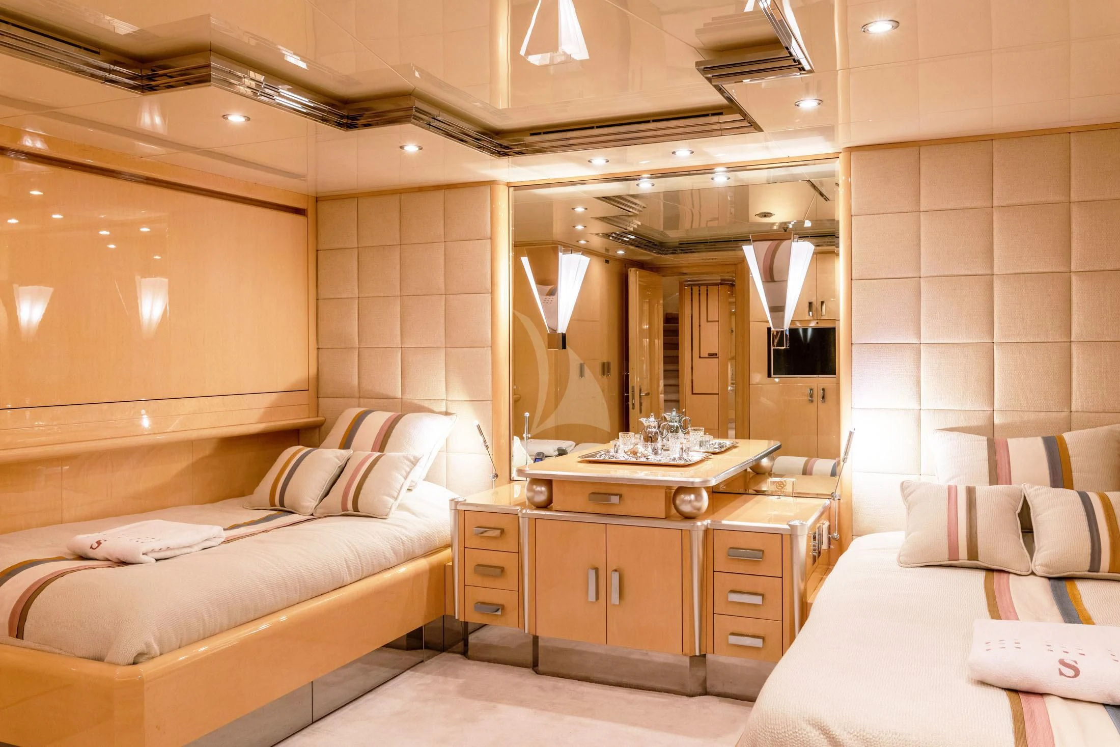 a room with a bed and a mirror aboard SUNDAY Yacht for Charter