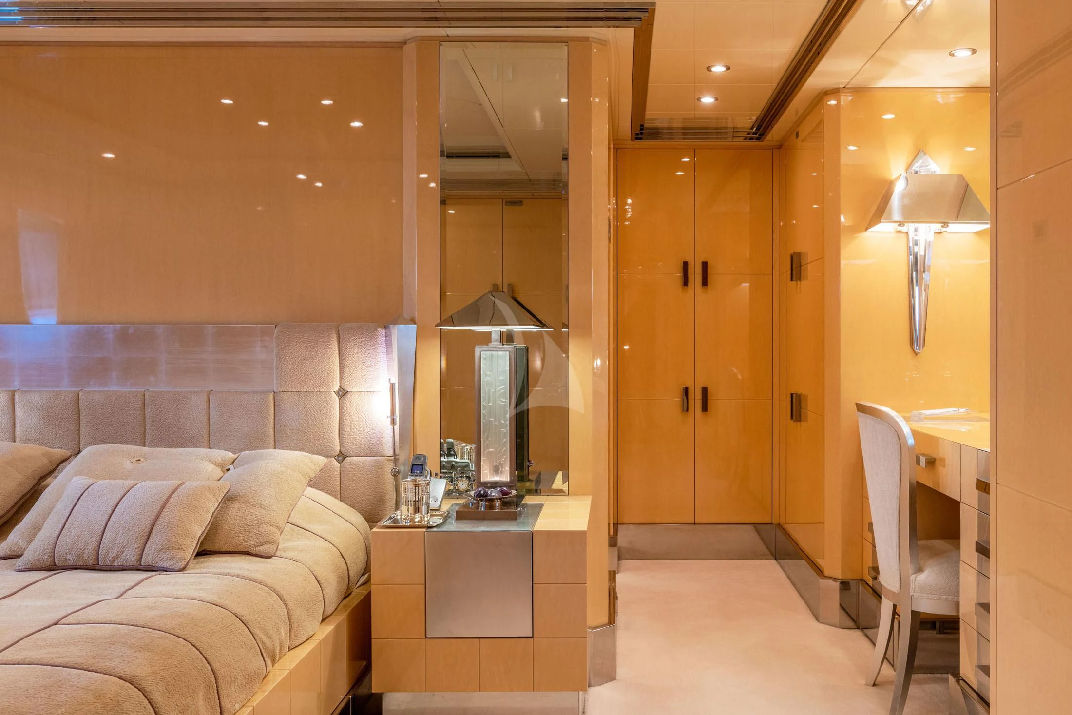 a room with a bed and a desk aboard SUNDAY Yacht for Charter