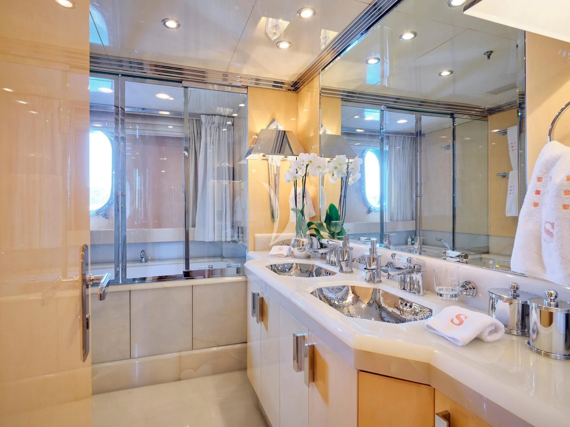 a bathroom with a large mirror aboard SUNDAY Yacht for Charter