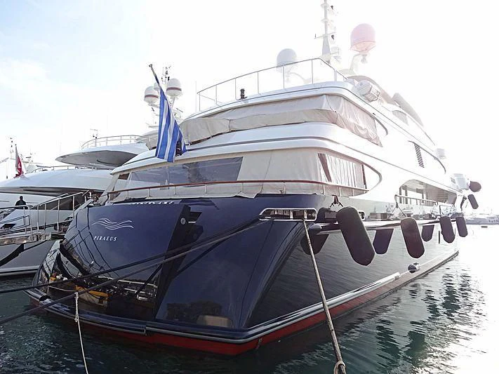 a boat docked at a pier aboard SUNDAY Yacht for Charter
