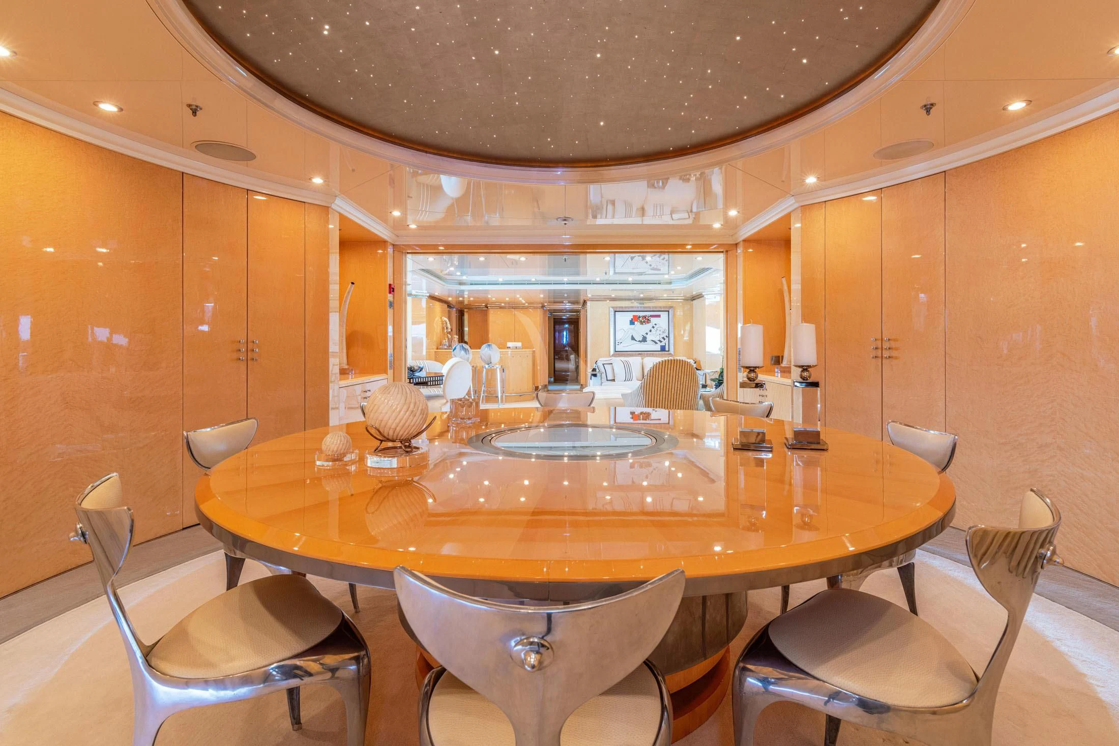 a large dining table with chairs aboard SUNDAY Yacht for Charter