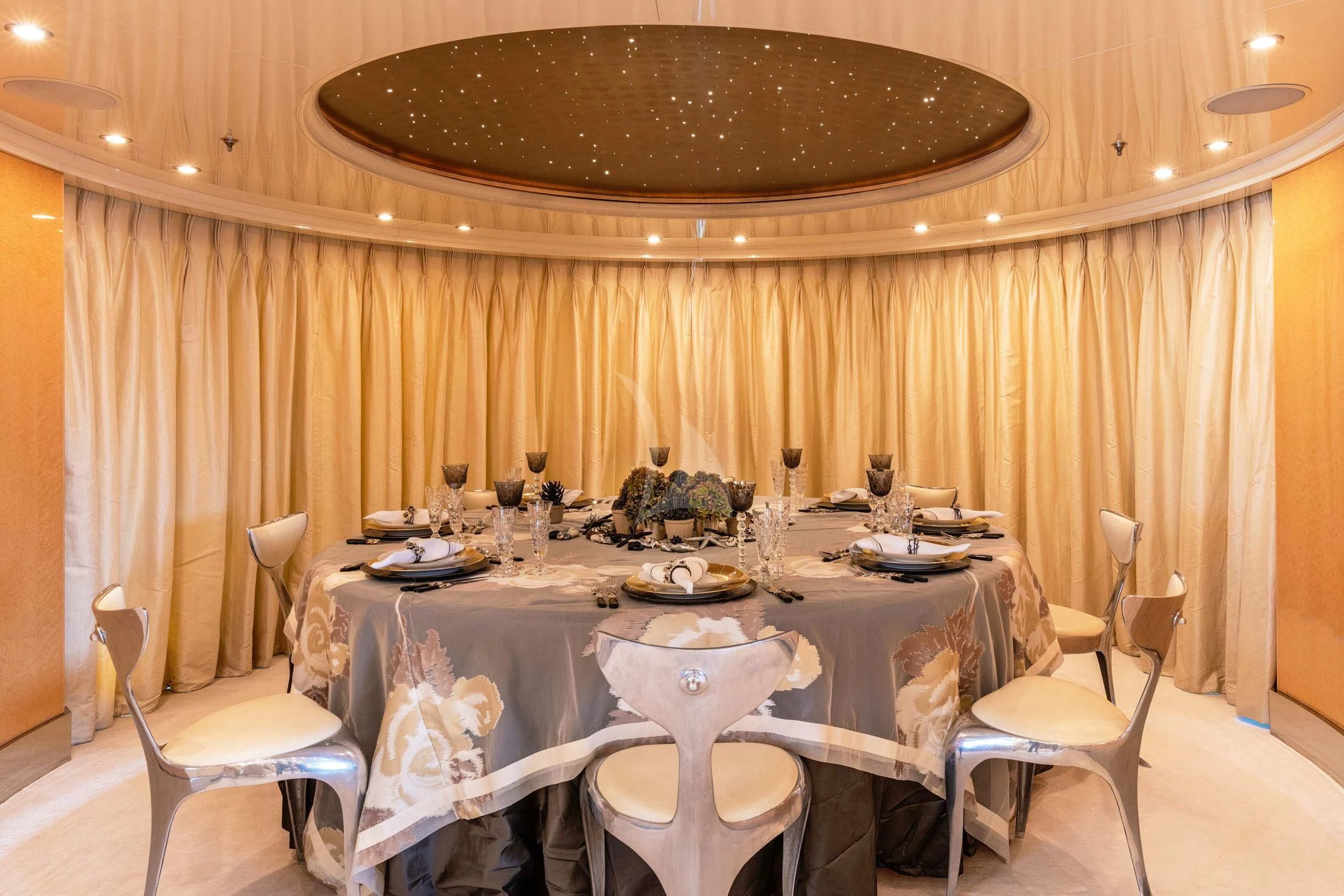 a dining room table with chairs aboard SUNDAY Yacht for Charter
