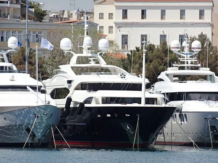 several boats docked at a pier aboard SUNDAY Yacht for Charter