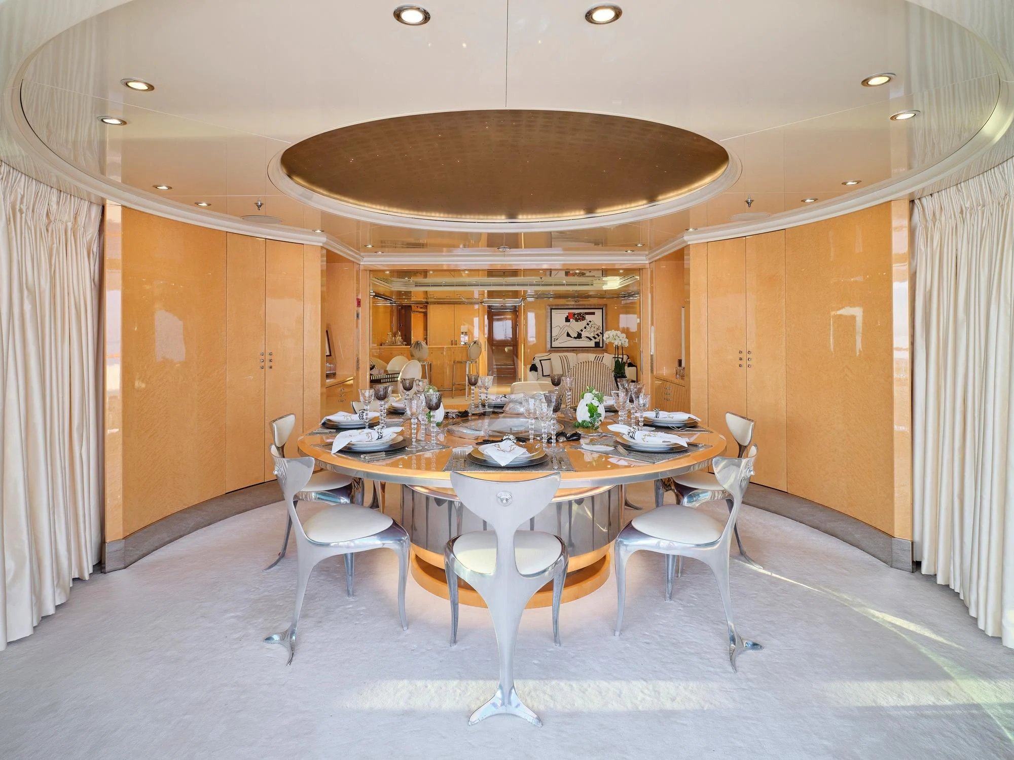 a large room with a table and chairs aboard SUNDAY Yacht for Charter