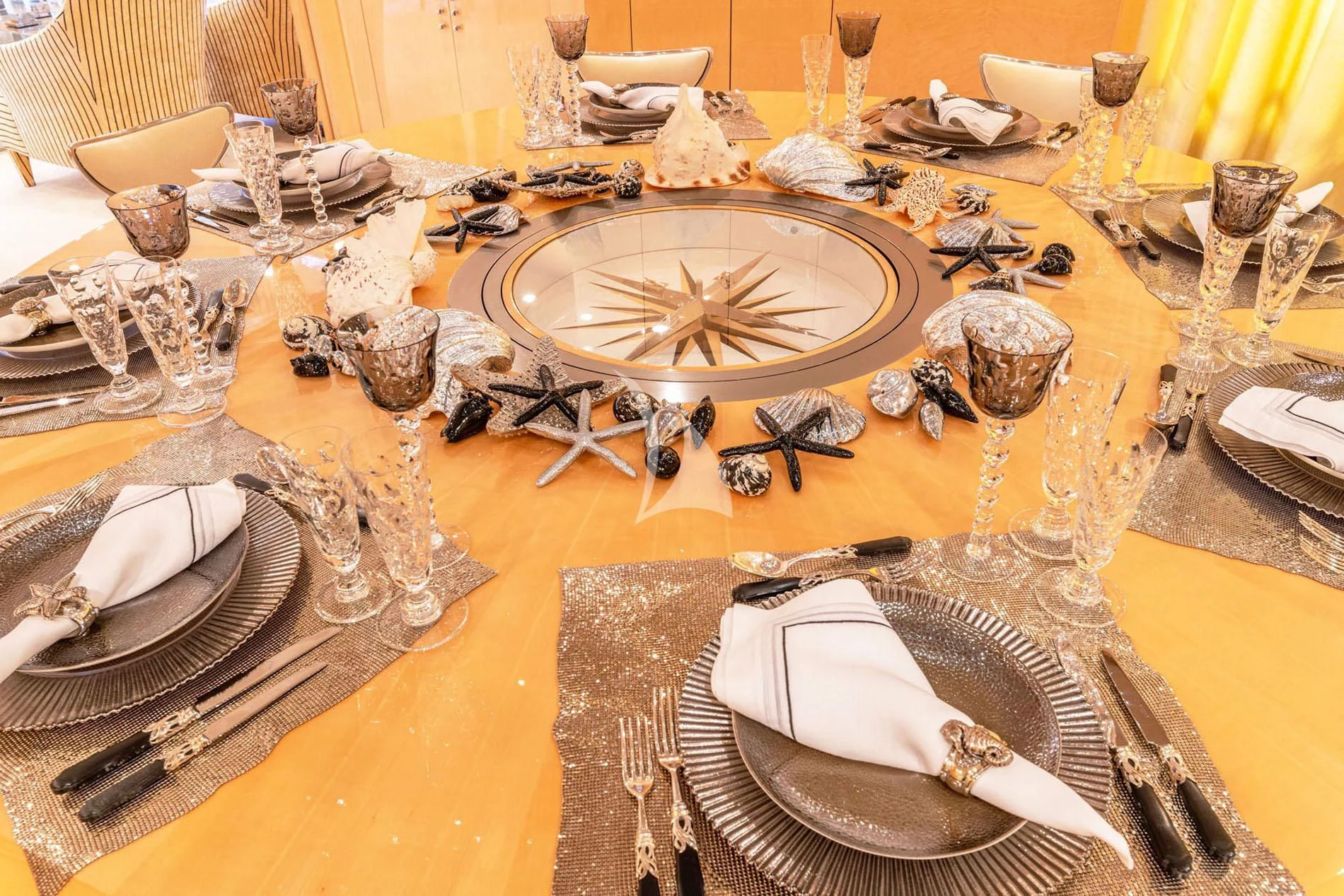 a table with plates and glasses aboard SUNDAY Yacht for Charter