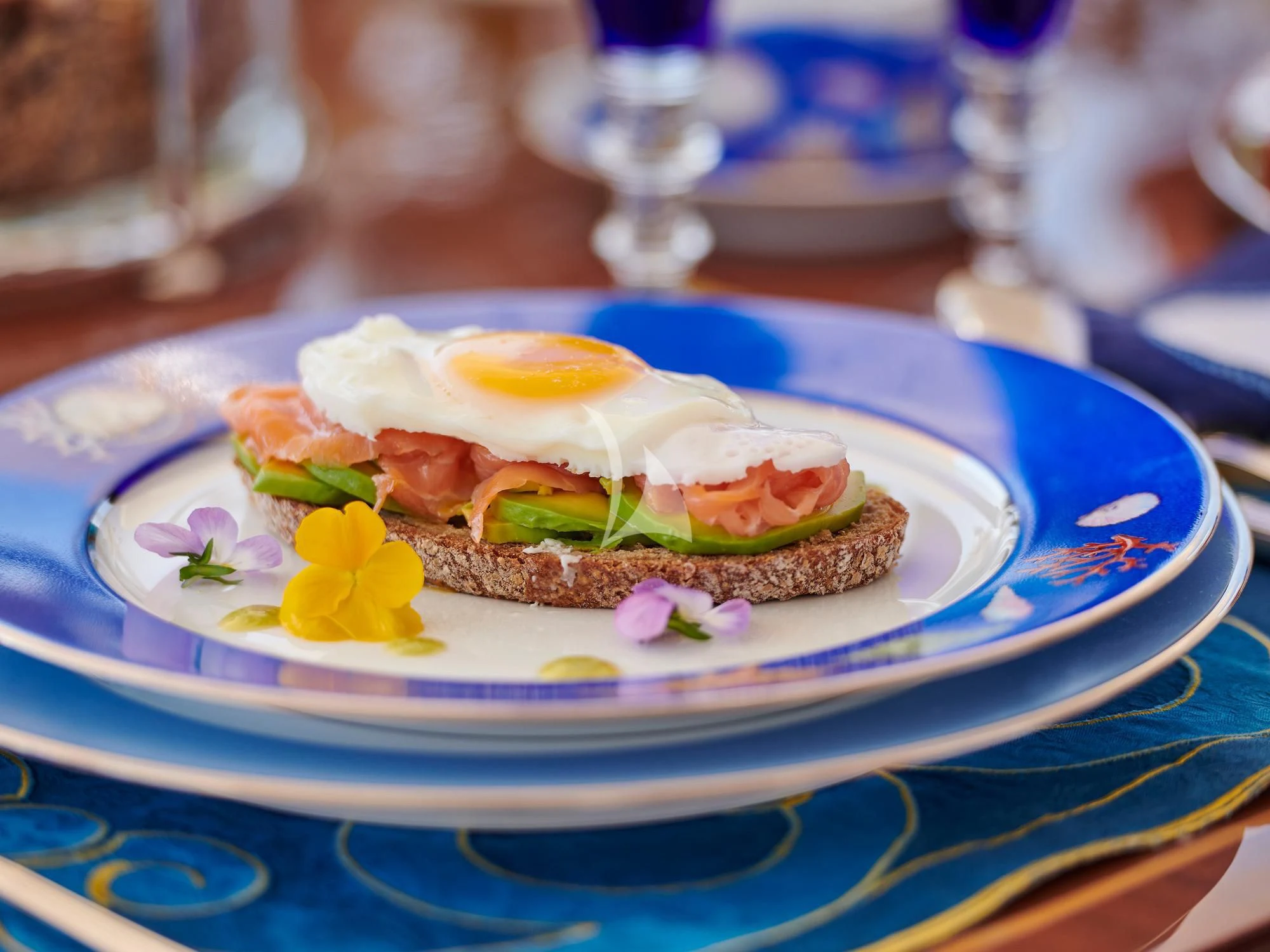a sandwich on a plate aboard SUNDAY Yacht for Charter
