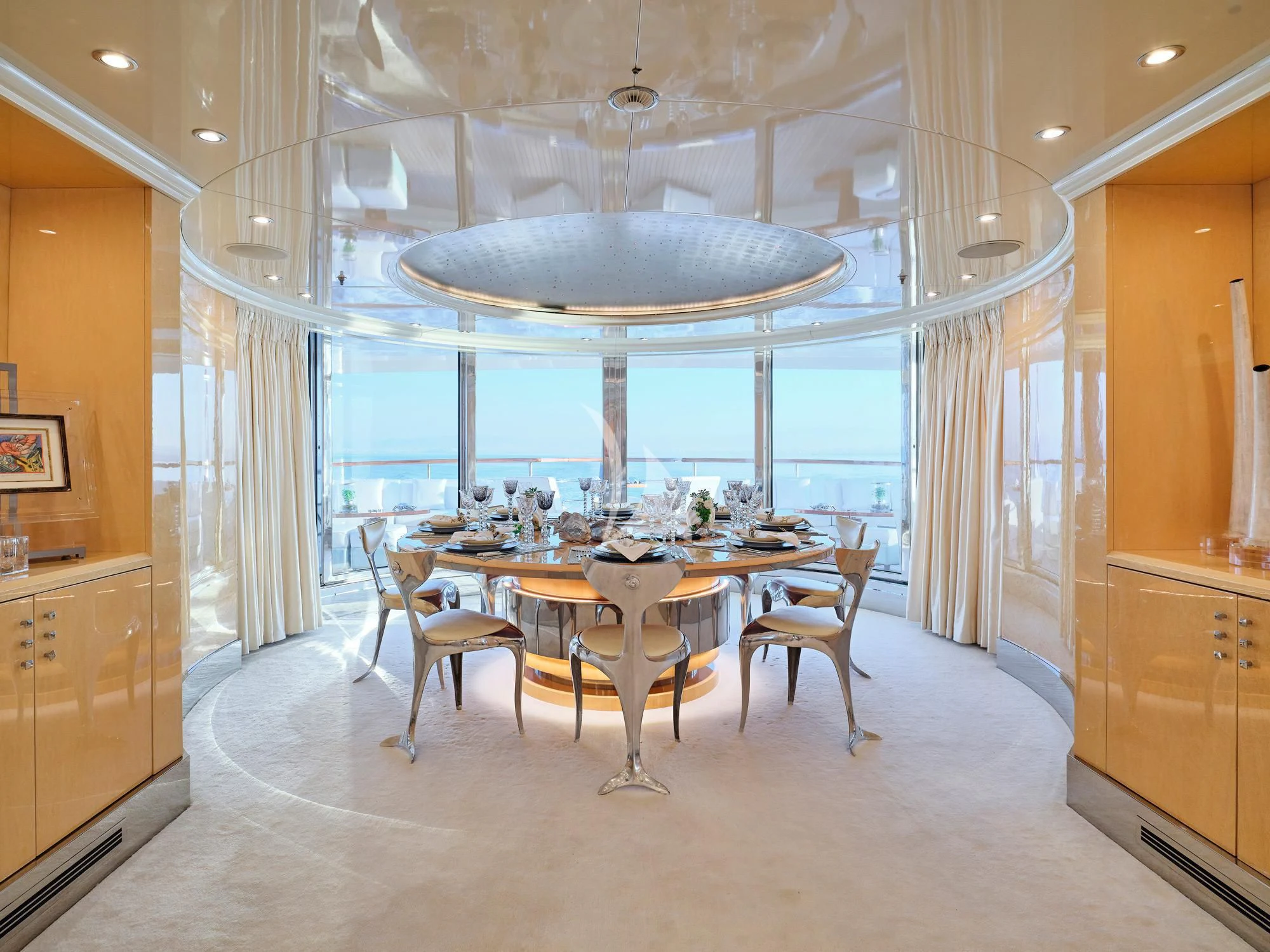 a large room with a table and chairs aboard SUNDAY Yacht for Charter