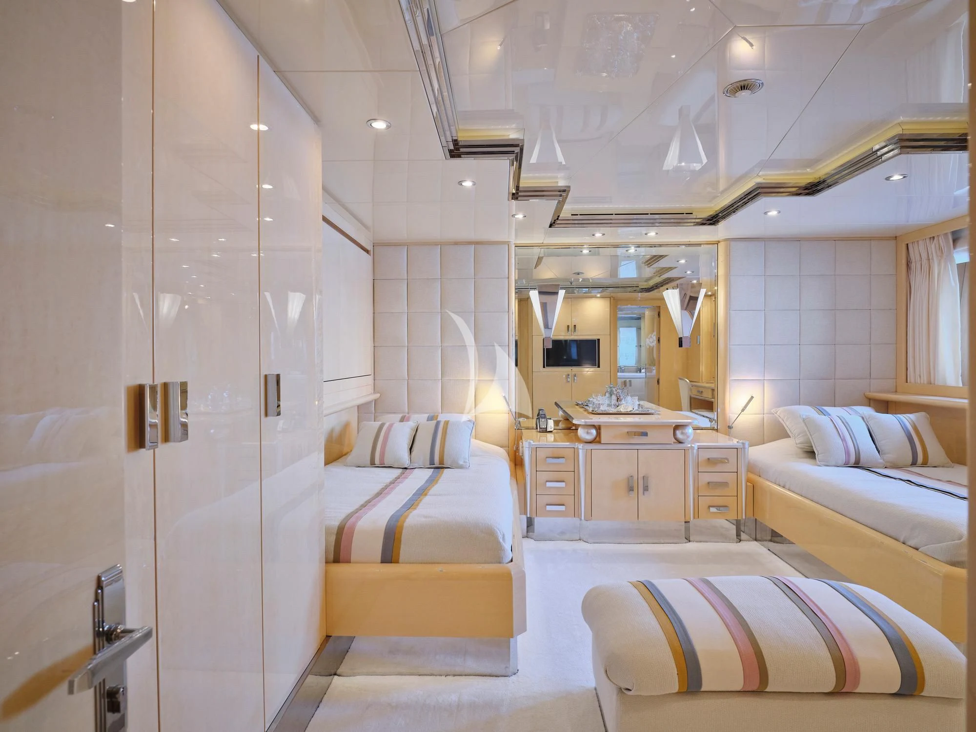 a room with a bed and a mirror aboard SUNDAY Yacht for Charter