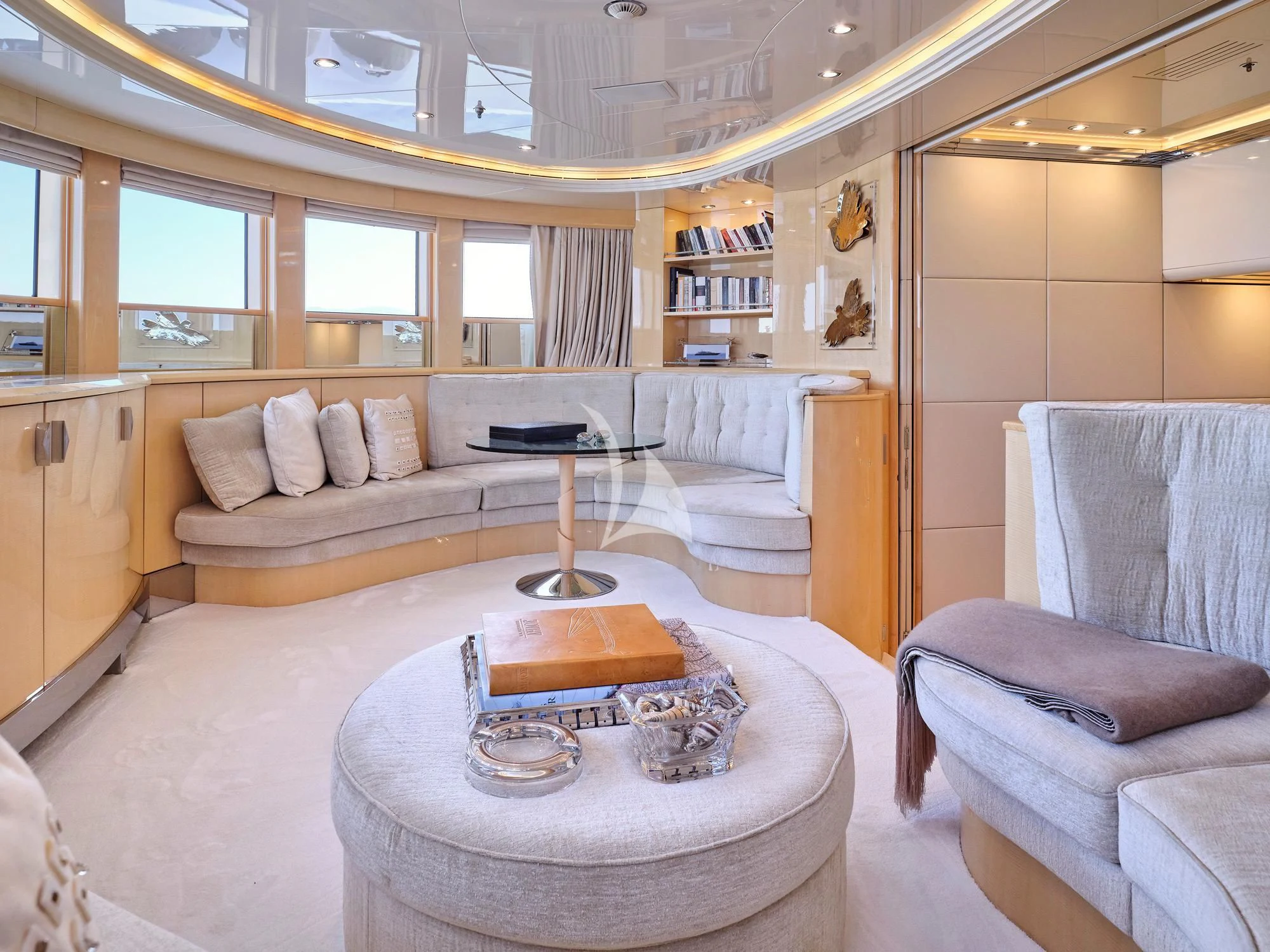 a room with a bed and a table aboard SUNDAY Yacht for Charter
