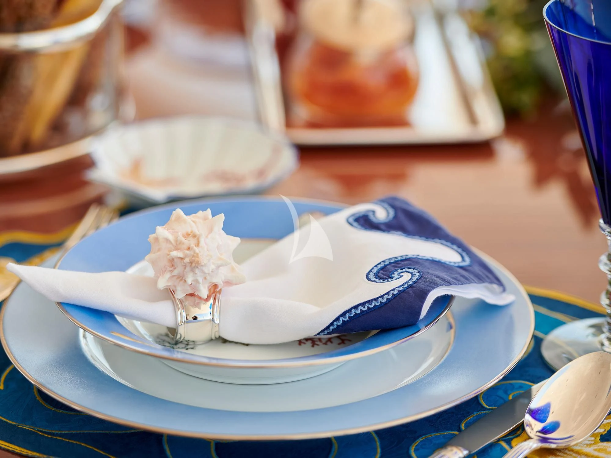 a blue and white dolphin on a plate aboard SUNDAY Yacht for Charter