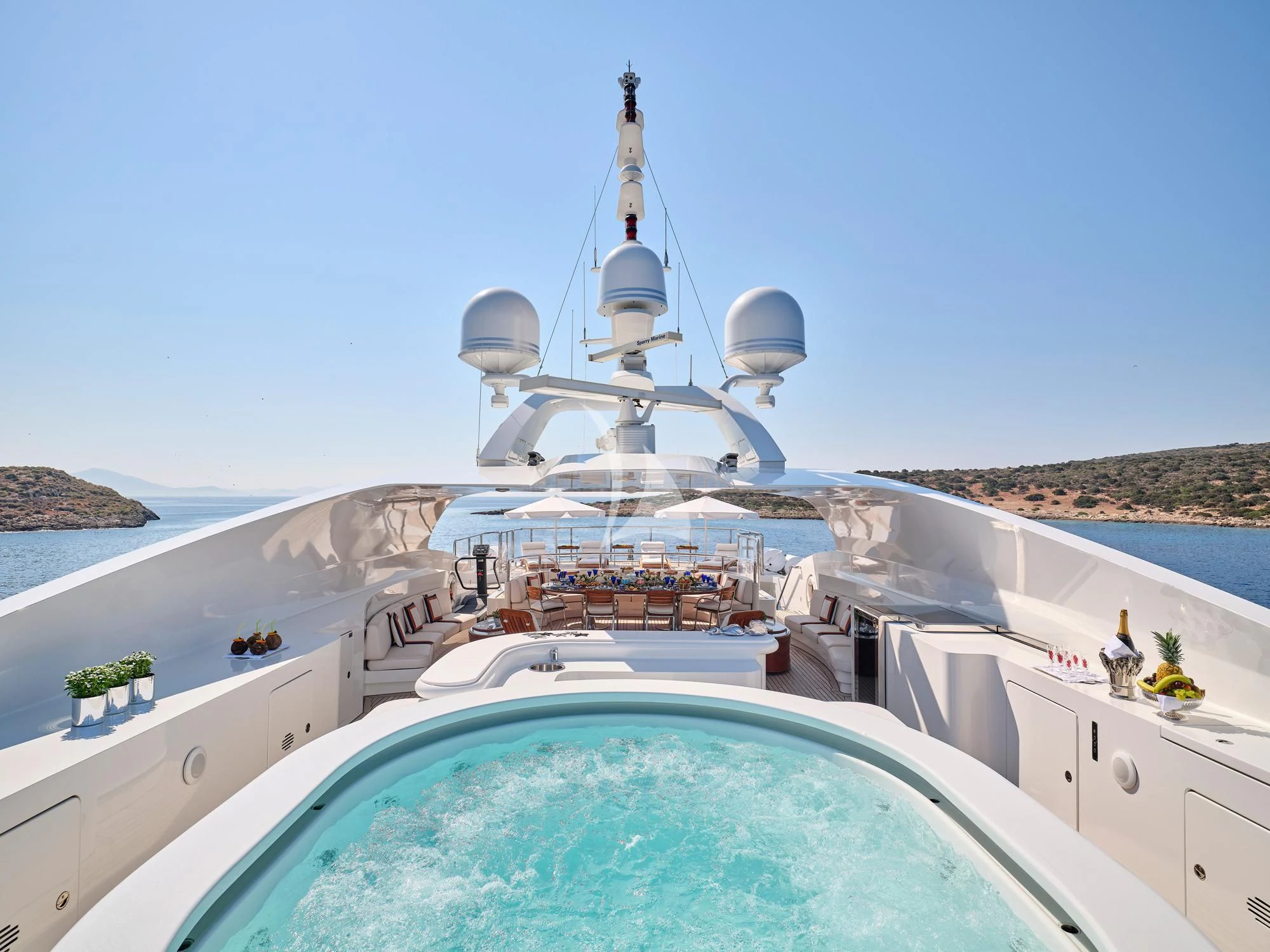a large ship with a satellite dish on the deck aboard SUNDAY Yacht for Charter