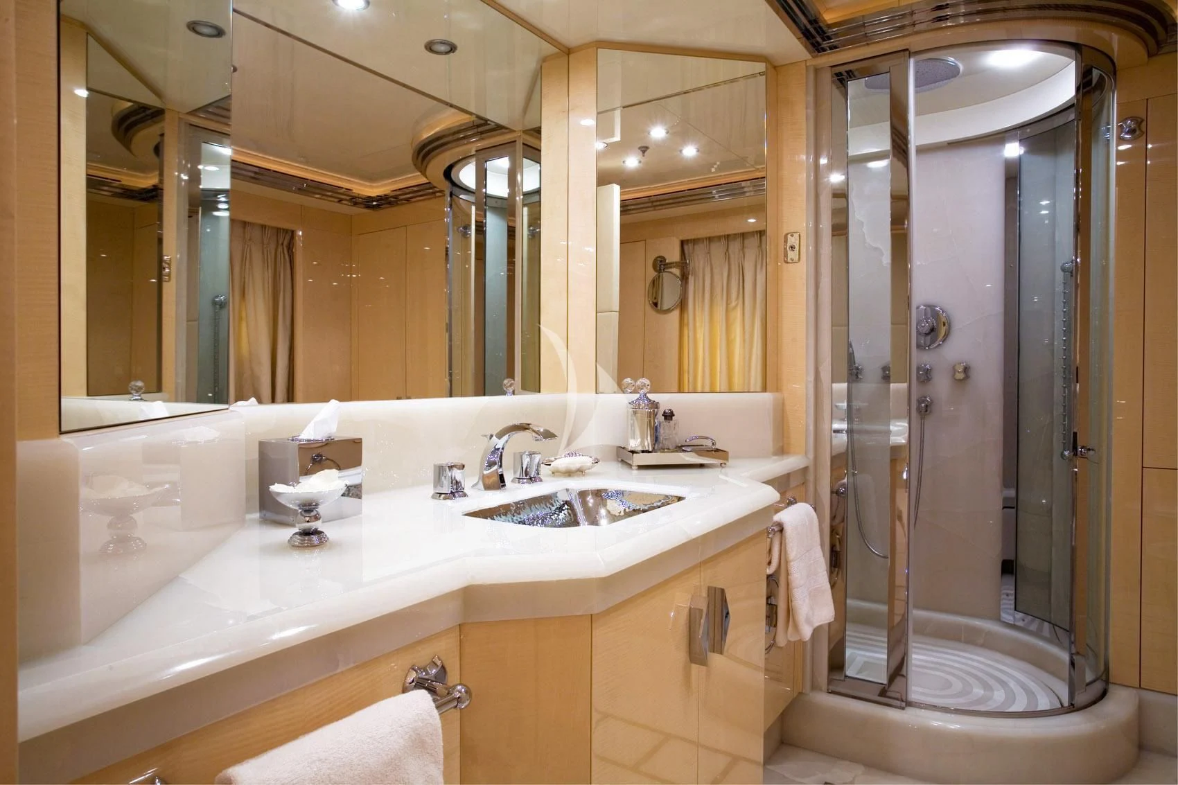 a bathroom with a shower sink and a mirror aboard SUNDAY Yacht for Charter