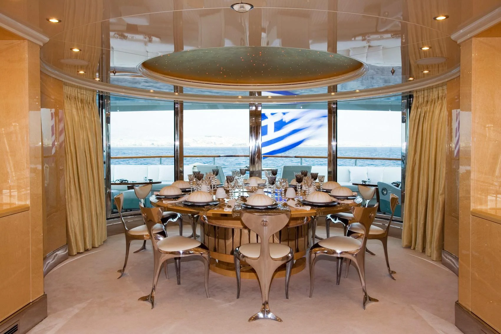a restaurant with a table and chairs aboard SUNDAY Yacht for Charter