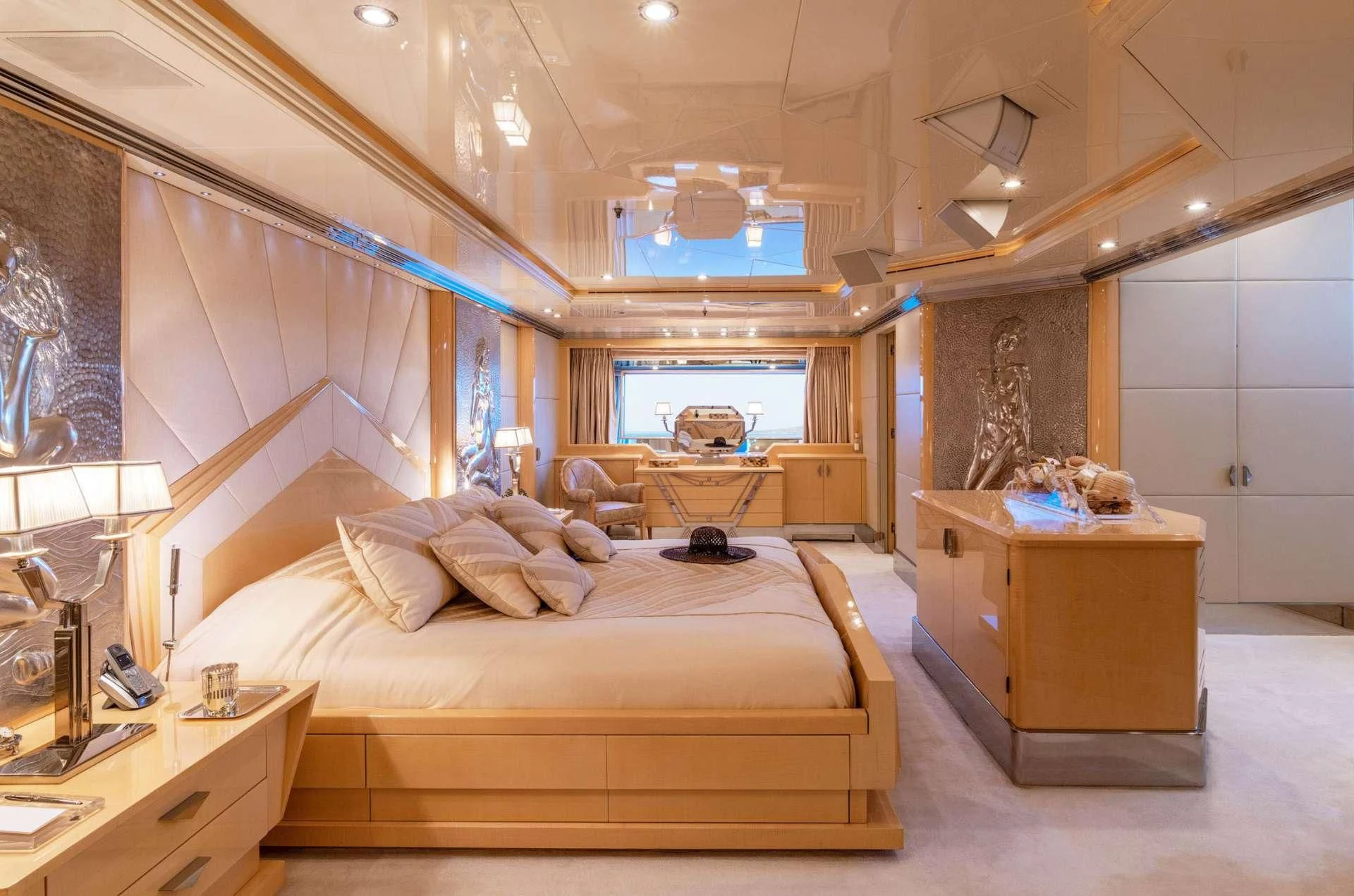 a bedroom with a large bed aboard SUNDAY Yacht for Charter