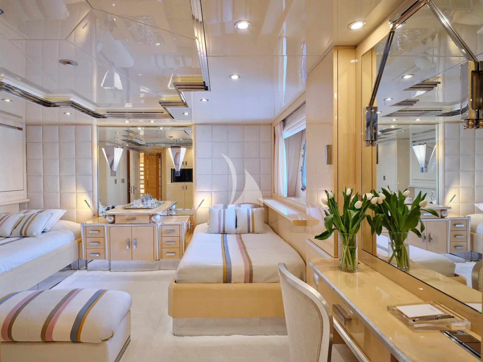a large room with a table and couches aboard SUNDAY Yacht for Charter