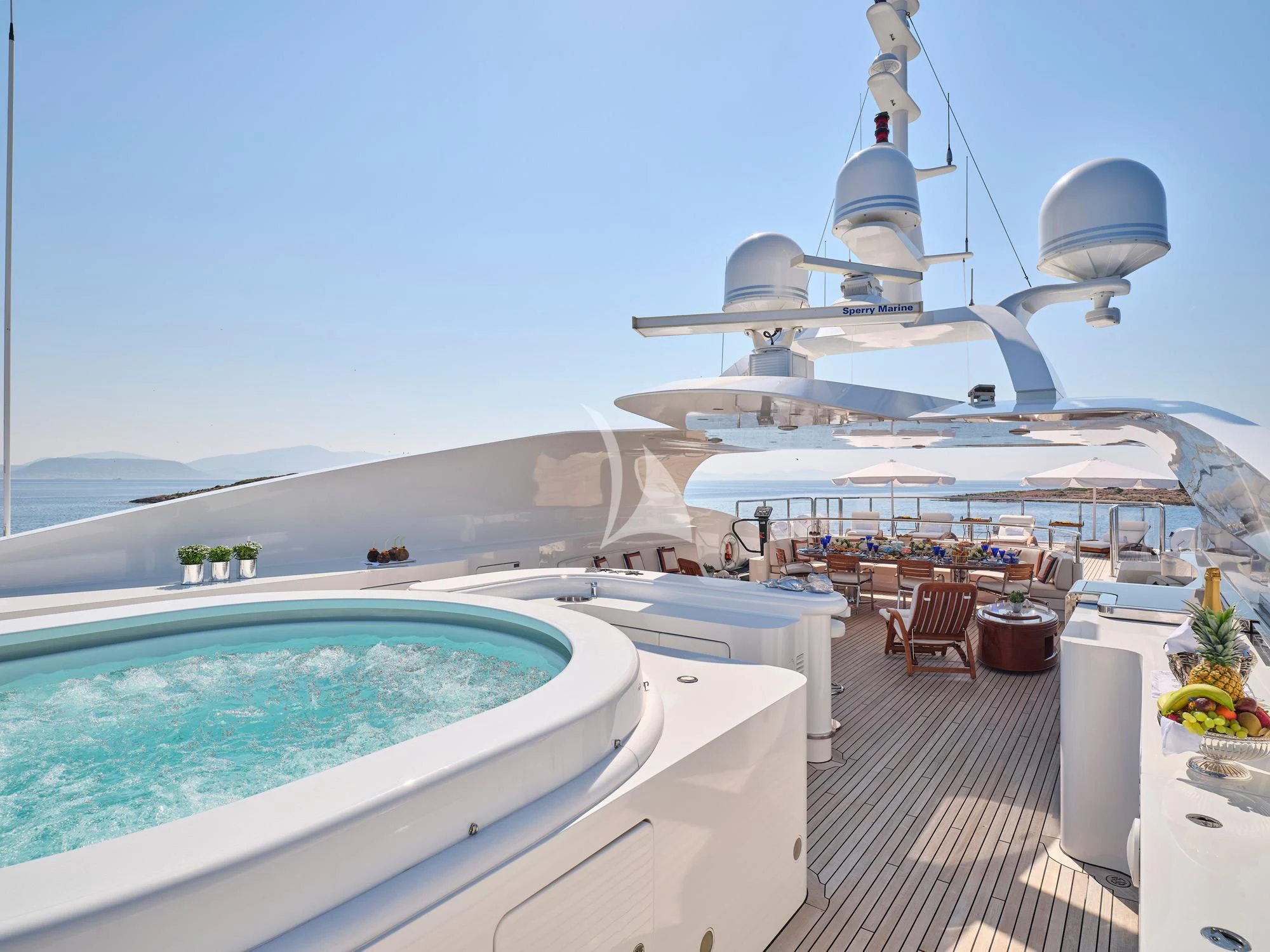 a large white building with a pool aboard SUNDAY Yacht for Charter
