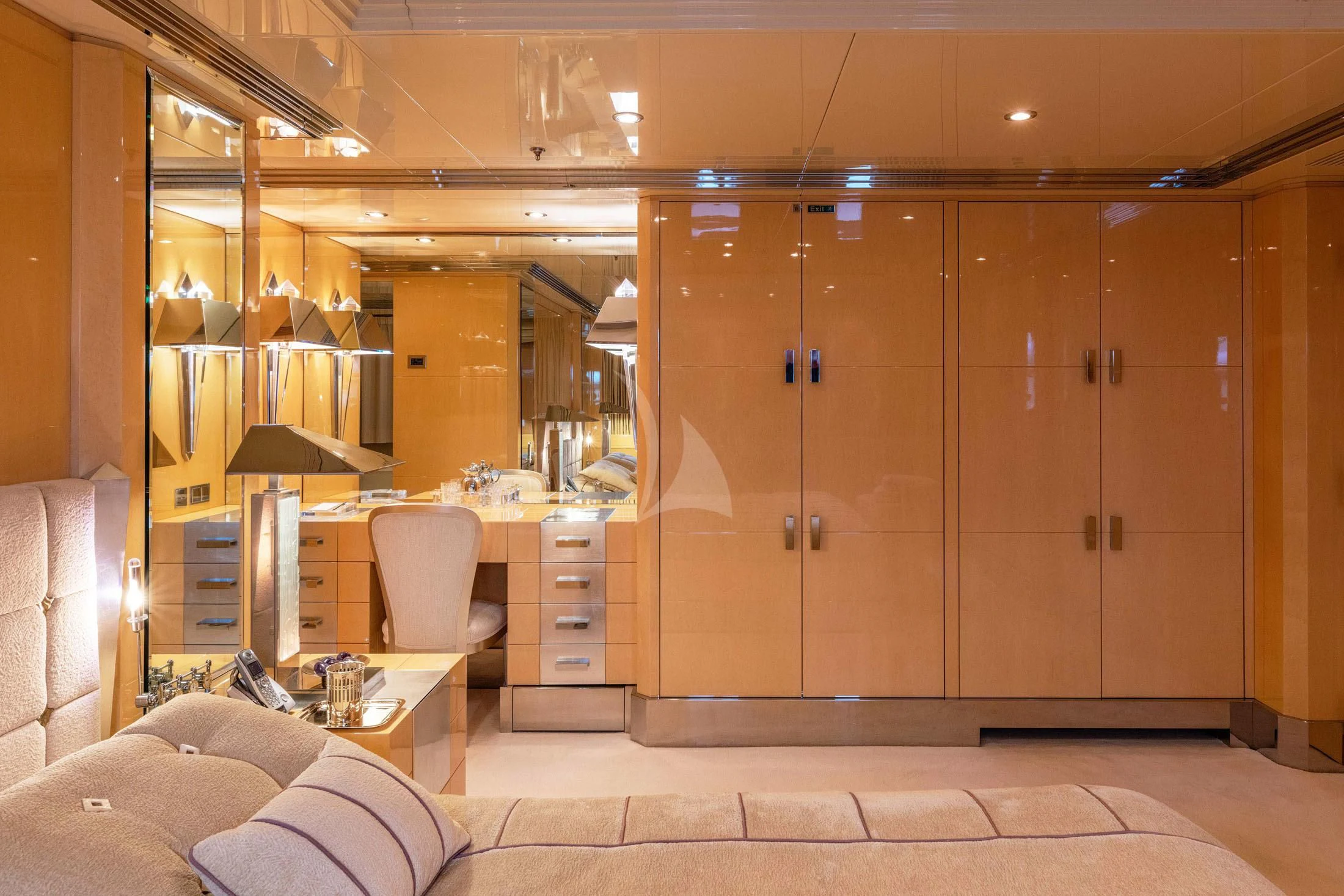 a room with a bed and a desk aboard SUNDAY Yacht for Charter