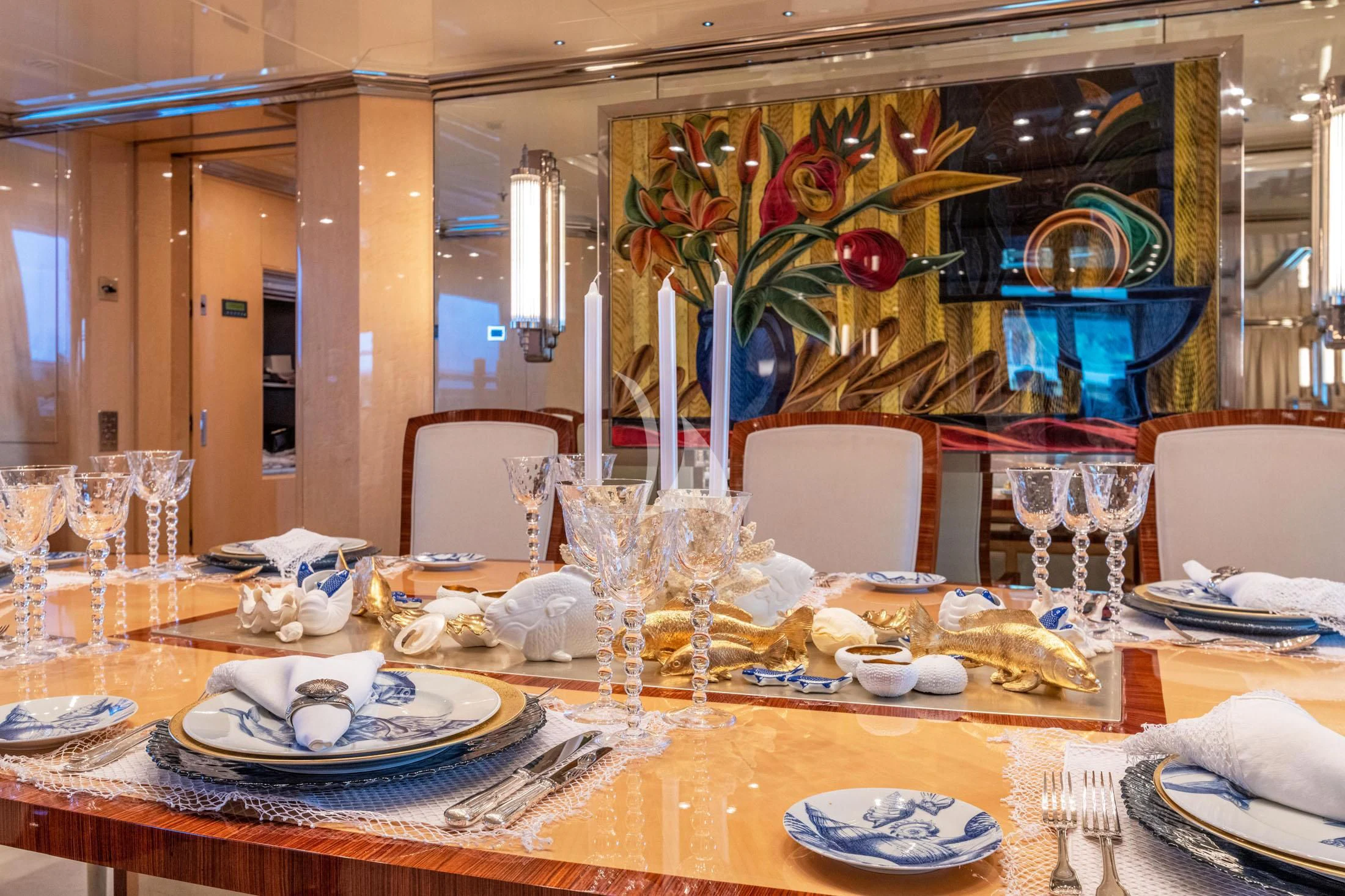 a dining room with a table set aboard SUNDAY Yacht for Charter
