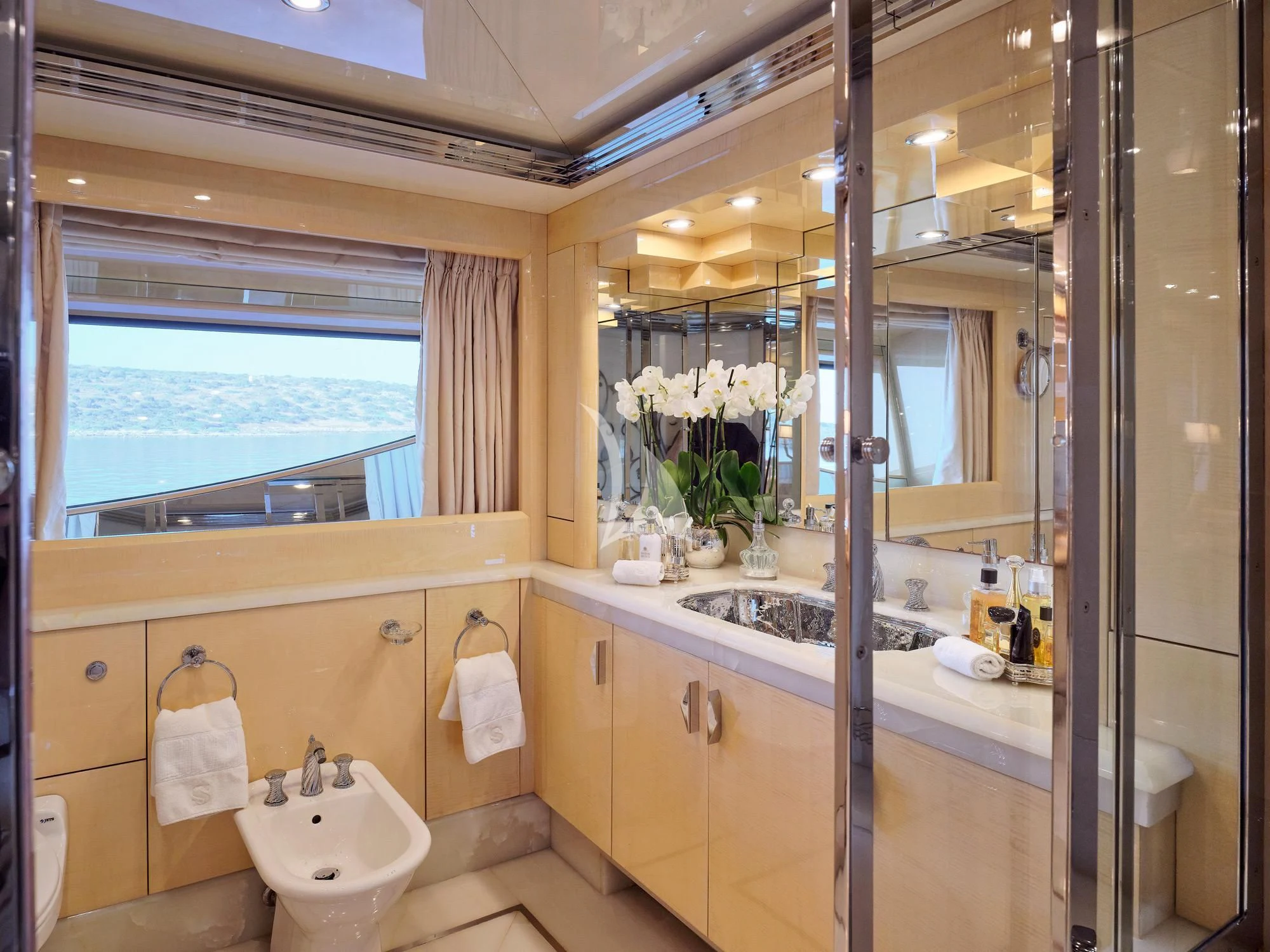a bathroom with a large mirror aboard SUNDAY Yacht for Charter