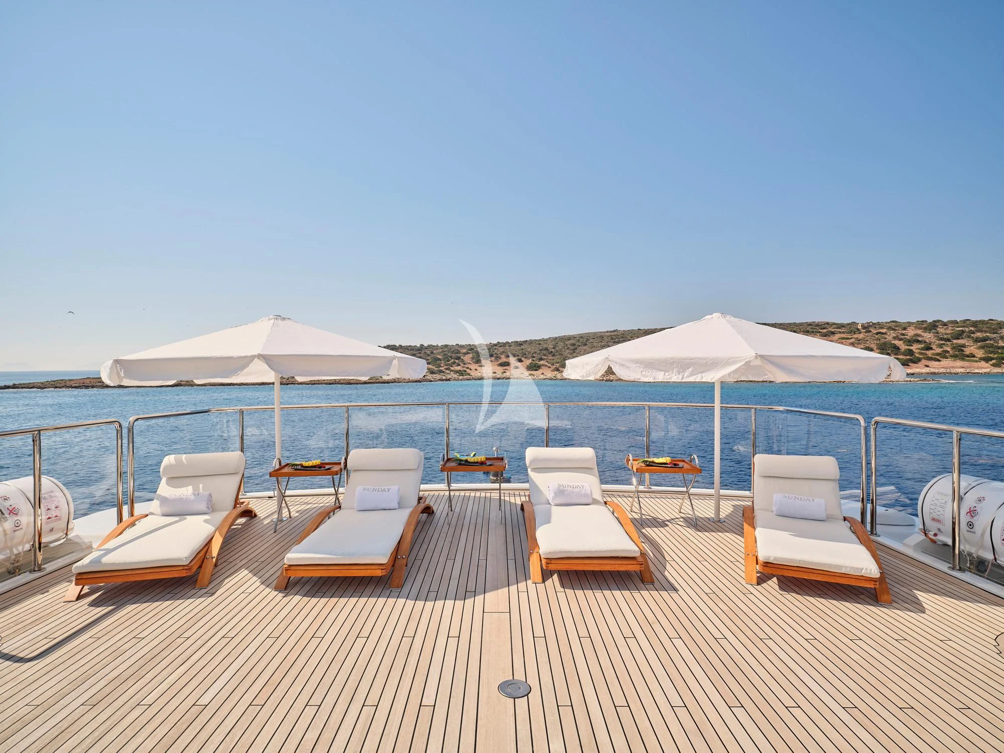 a deck with chairs and umbrellas on it aboard SUNDAY Yacht for Charter