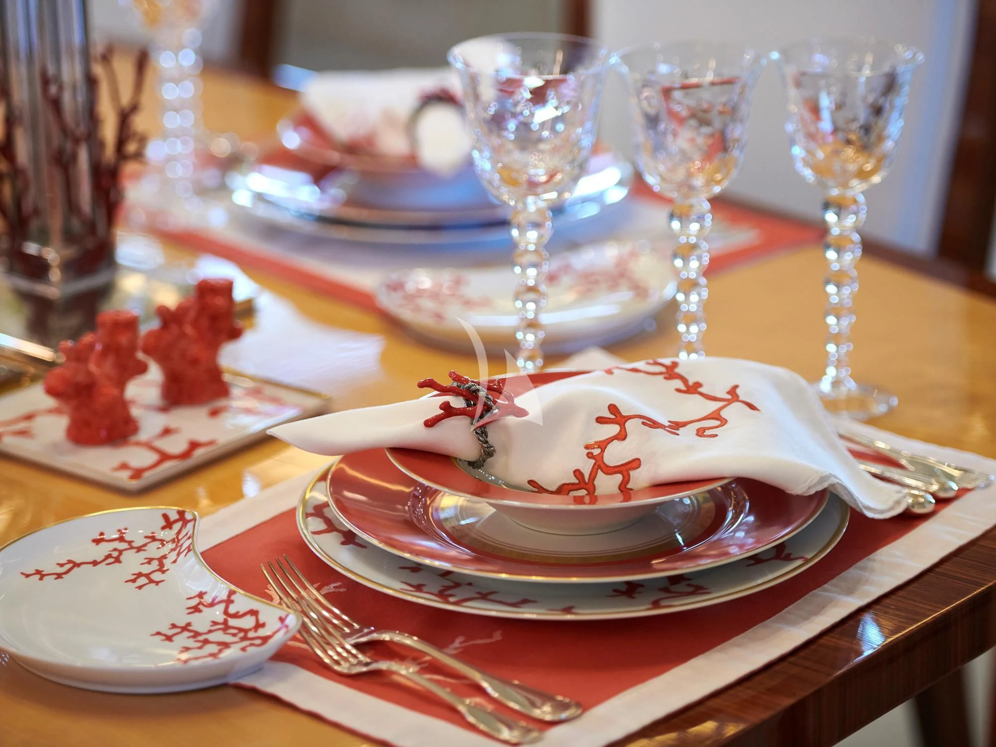 a table with plates and glasses aboard SUNDAY Yacht for Charter
