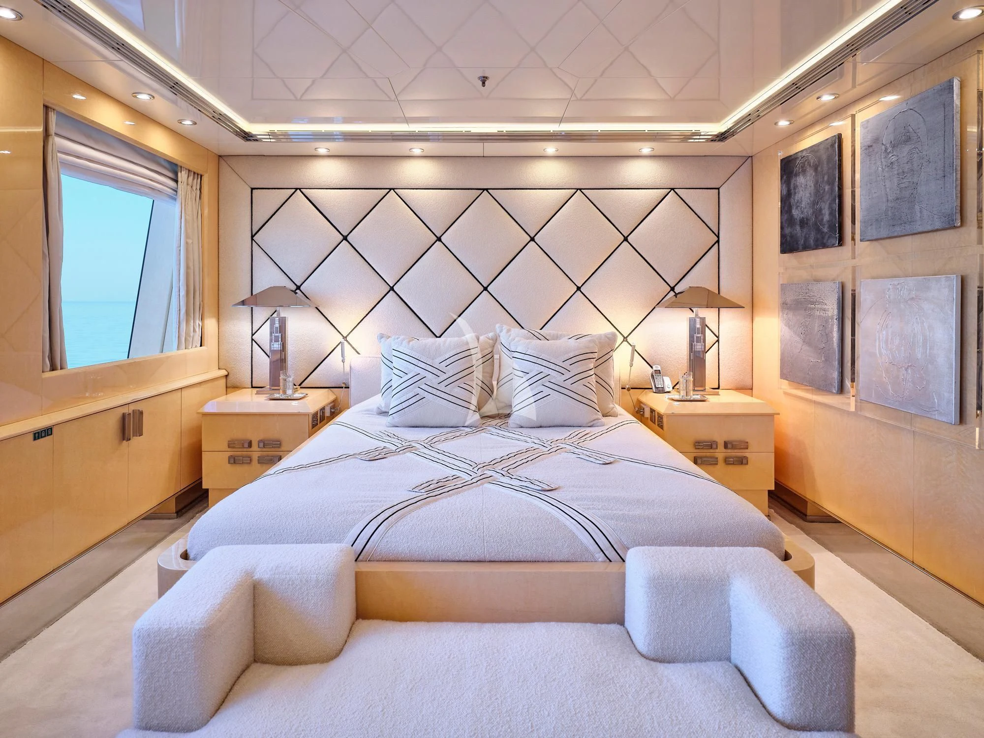 a bed with a white sheet aboard SUNDAY Yacht for Charter