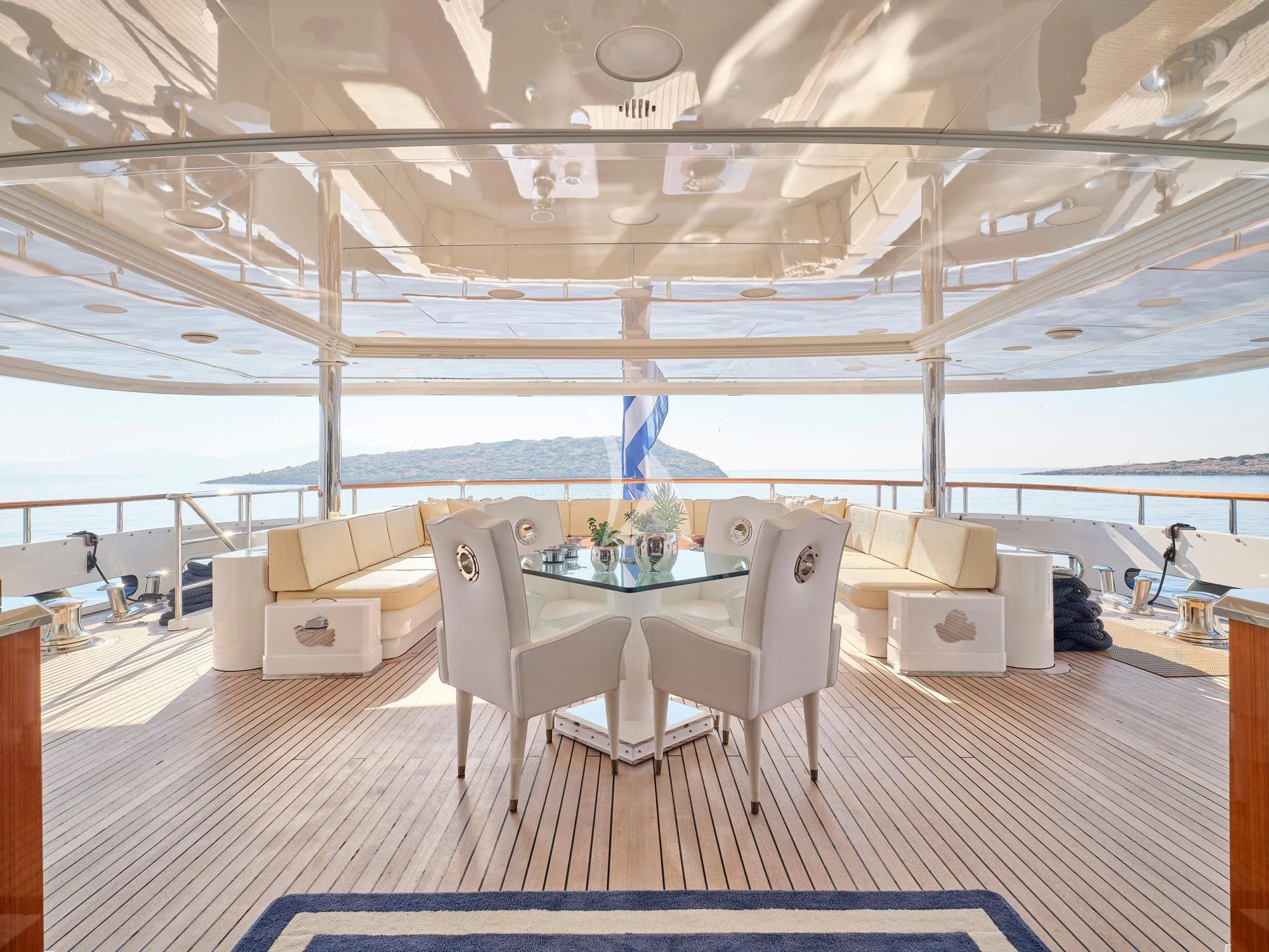 a room with a table and chairs aboard SUNDAY Yacht for Charter