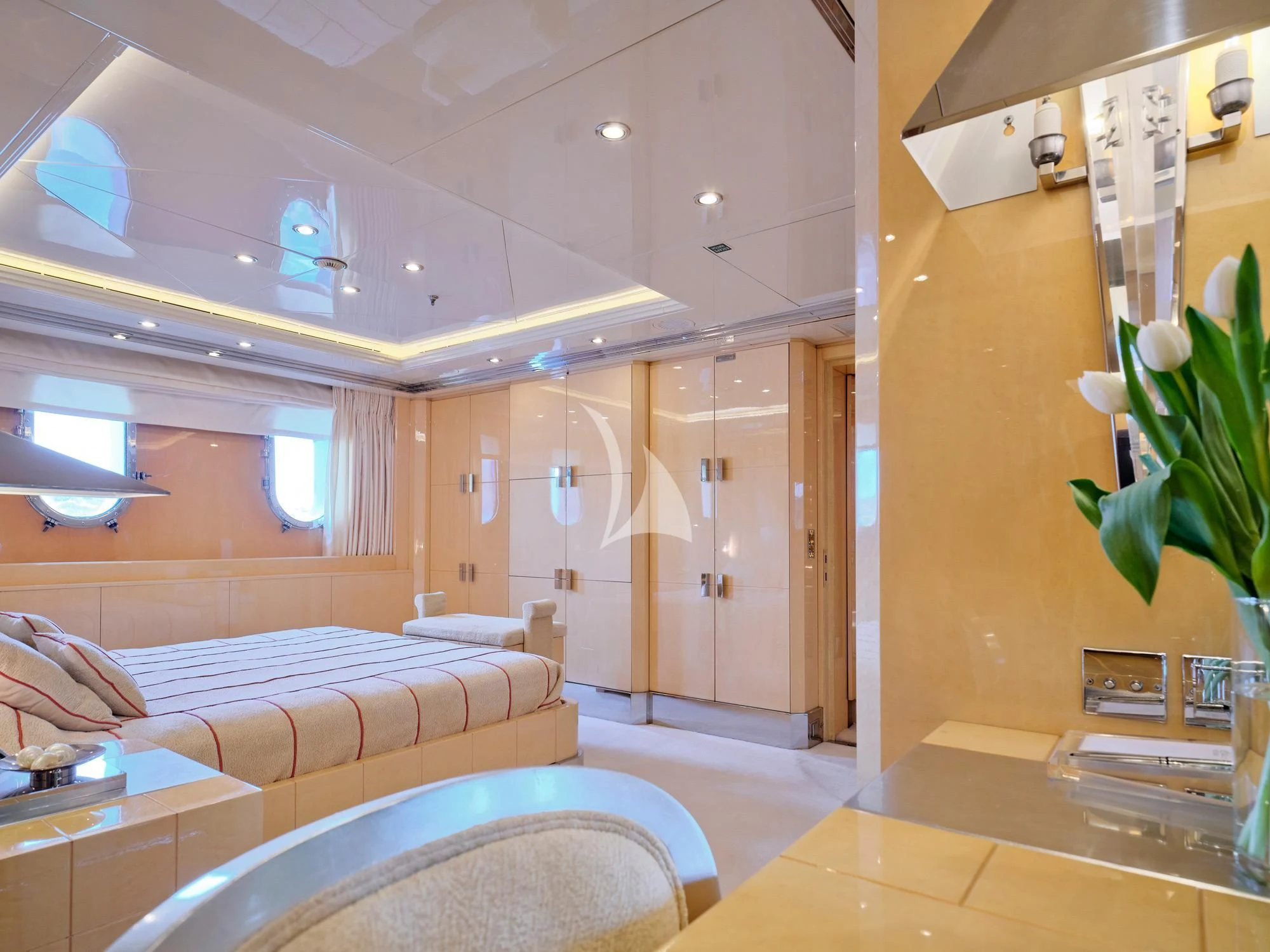 a room with a bed and a couch aboard SUNDAY Yacht for Charter