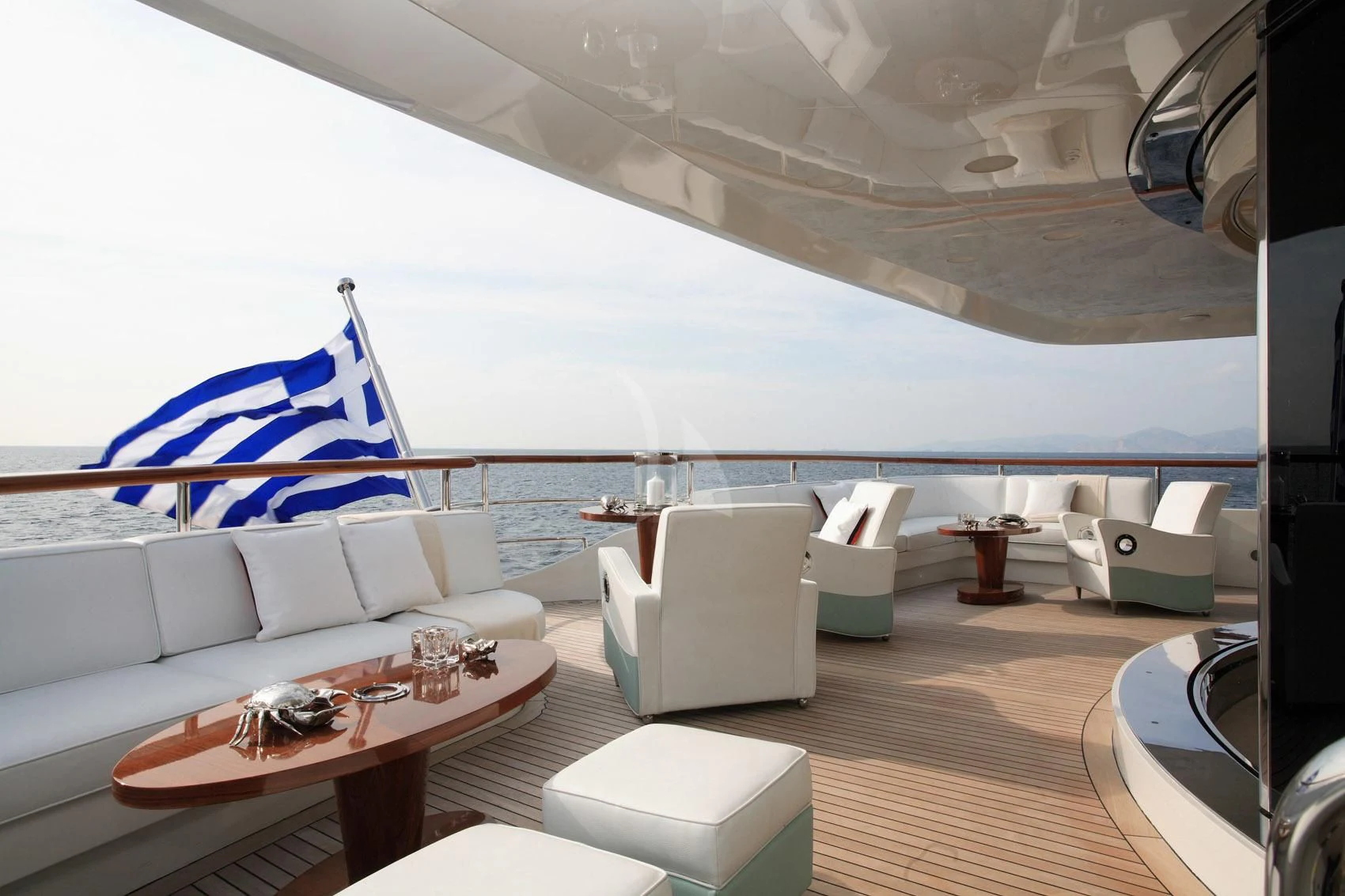 a room with a couch and a table and chairs aboard SUNDAY Yacht for Charter