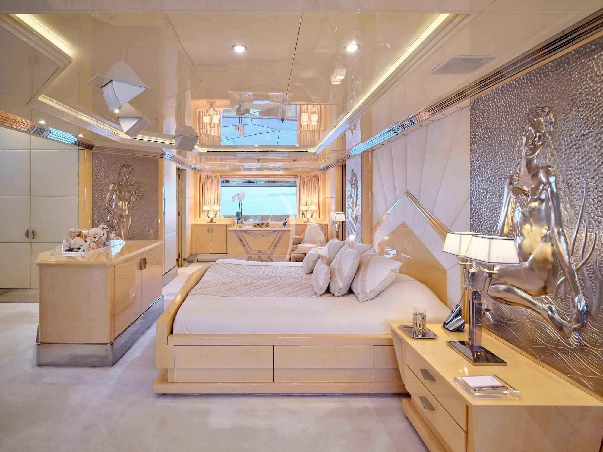 a bedroom with a large bed aboard SUNDAY Yacht for Charter