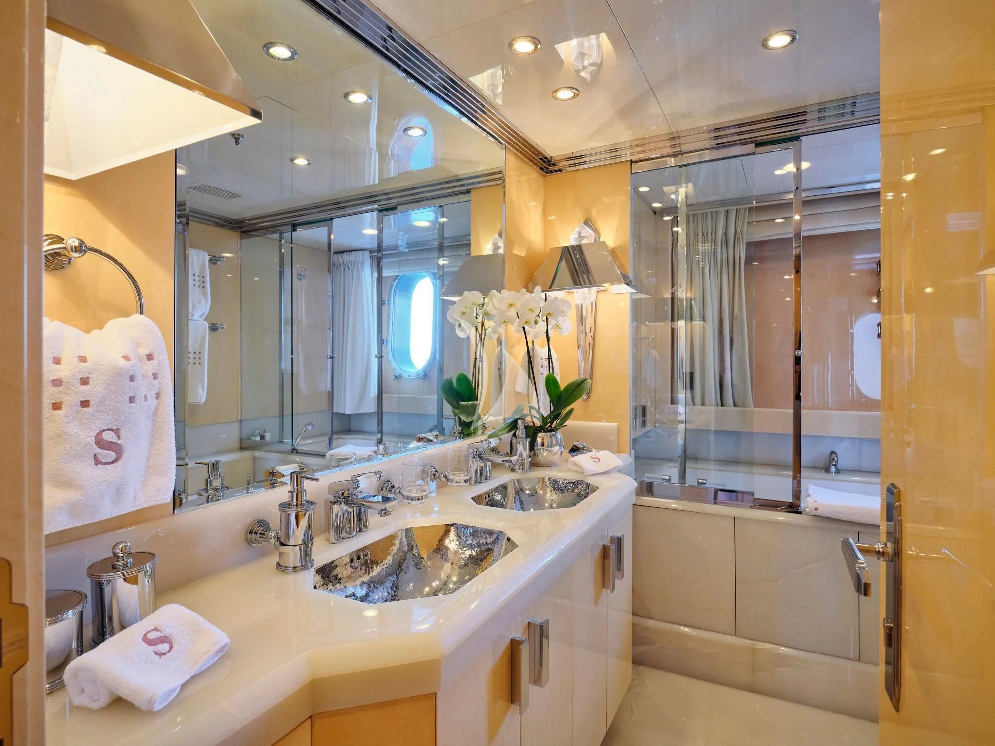 a bathroom with a large mirror aboard SUNDAY Yacht for Charter