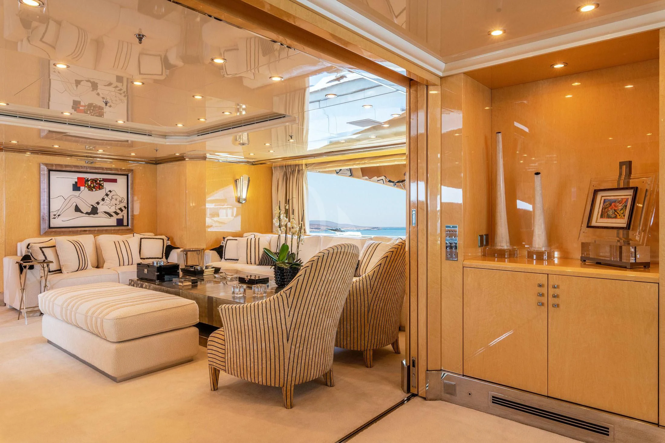 a room with a couch and a table and chairs aboard SUNDAY Yacht for Charter