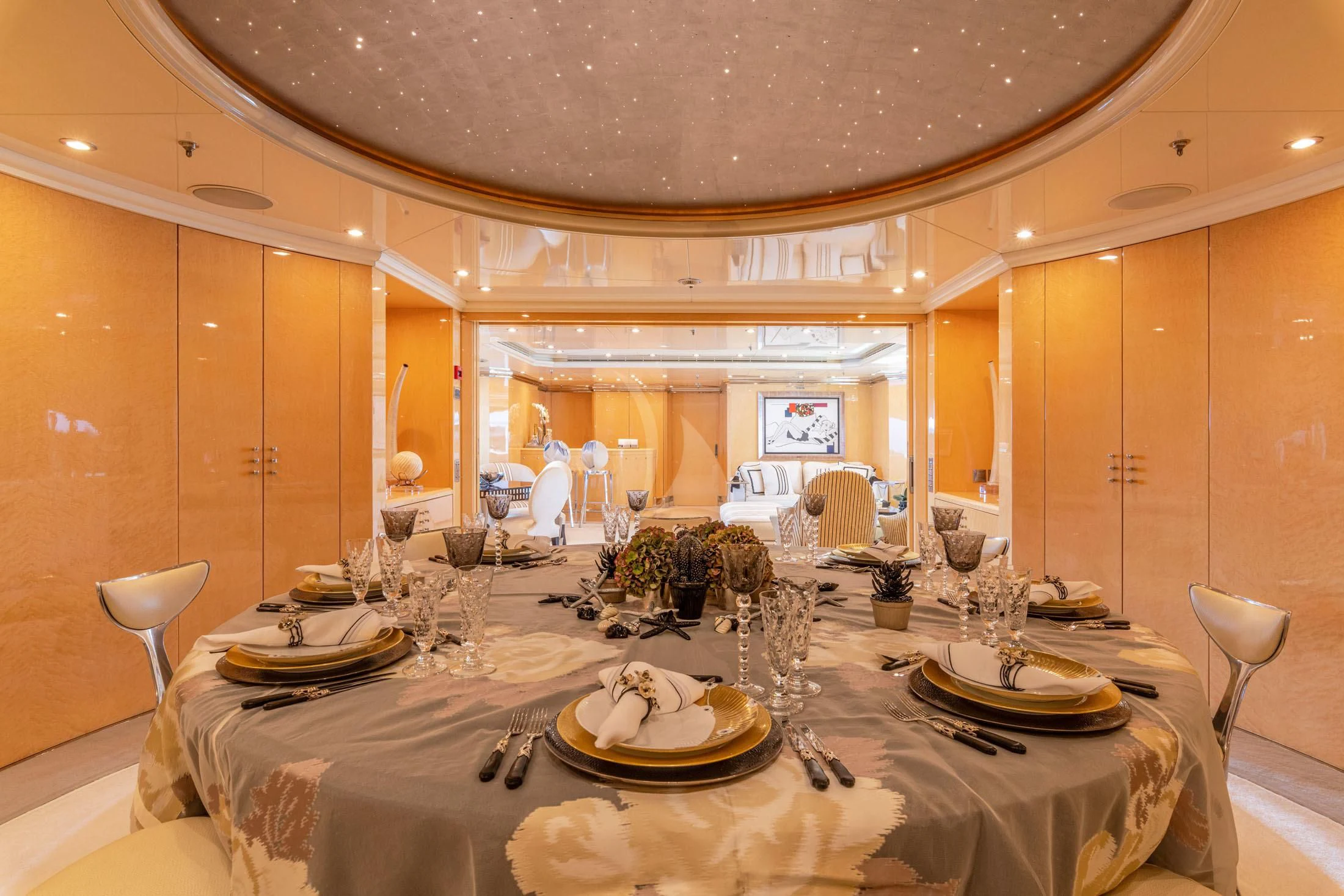 a table set with plates and chairs aboard SUNDAY Yacht for Charter
