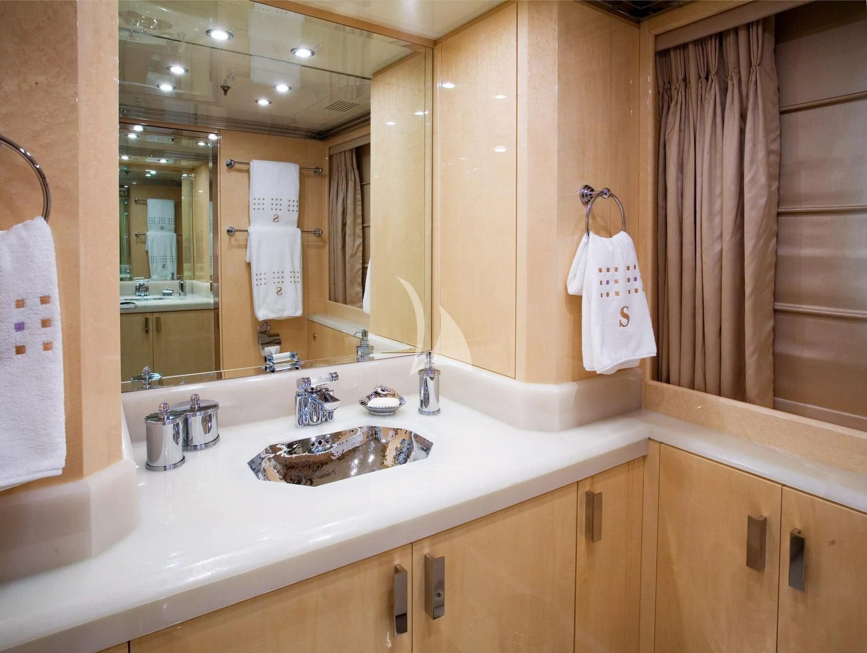 a bathroom with a sink and a mirror aboard SUNDAY Yacht for Charter