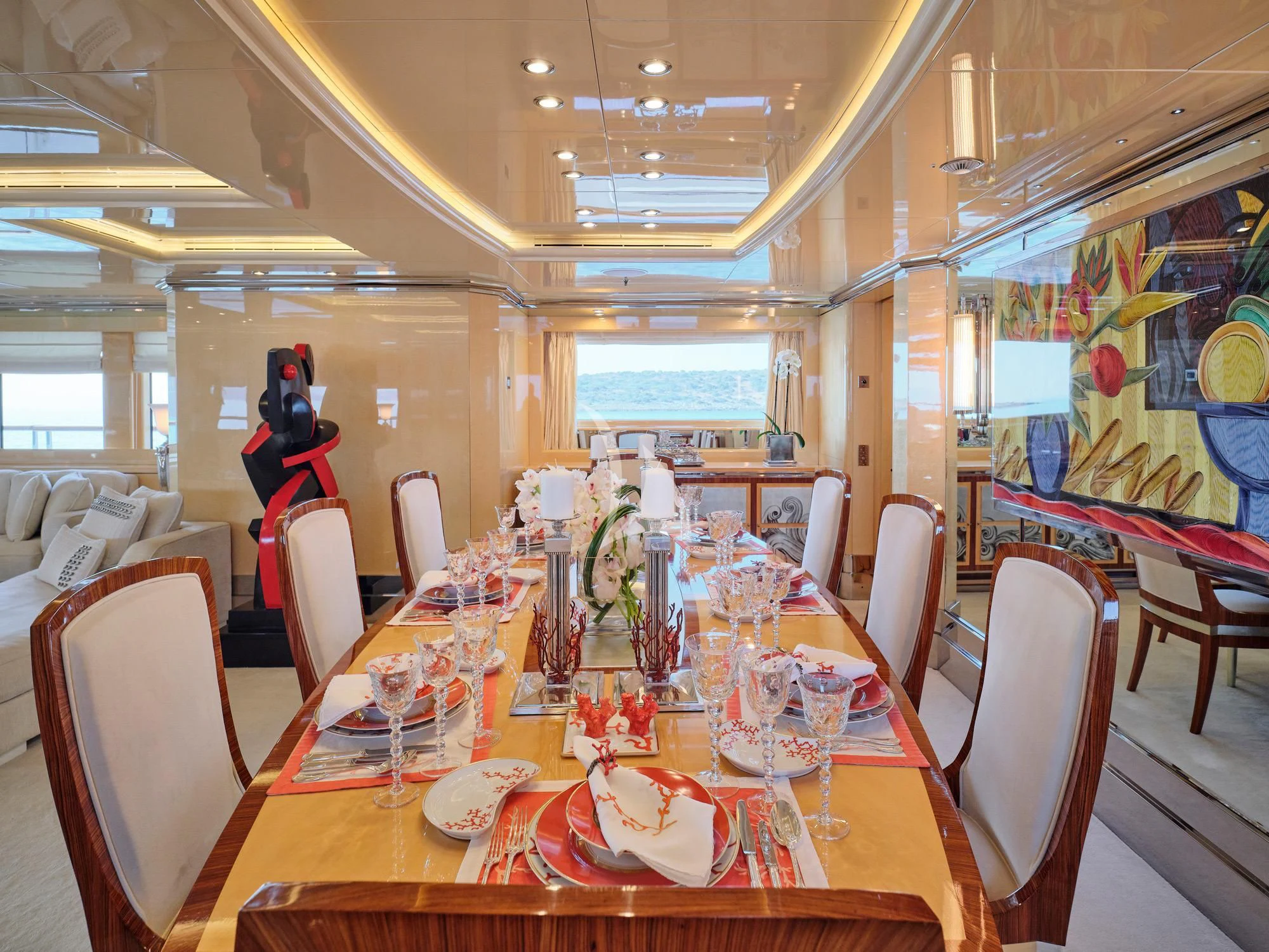 a dining room with a table set for a party aboard SUNDAY Yacht for Charter