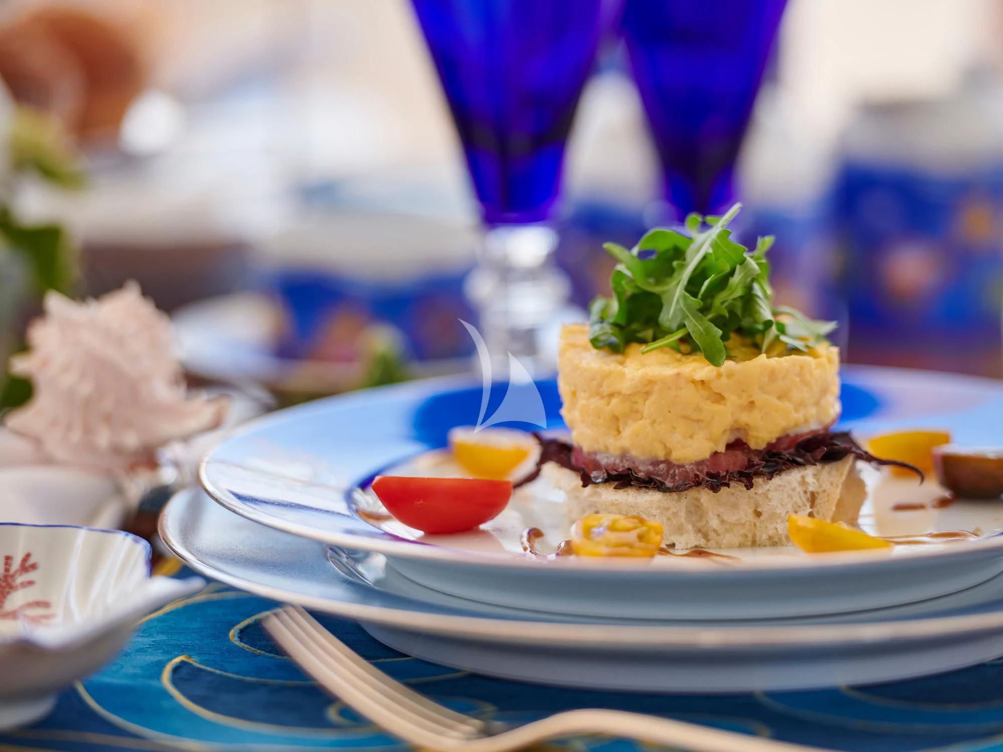 a dessert on a plate aboard SUNDAY Yacht for Charter