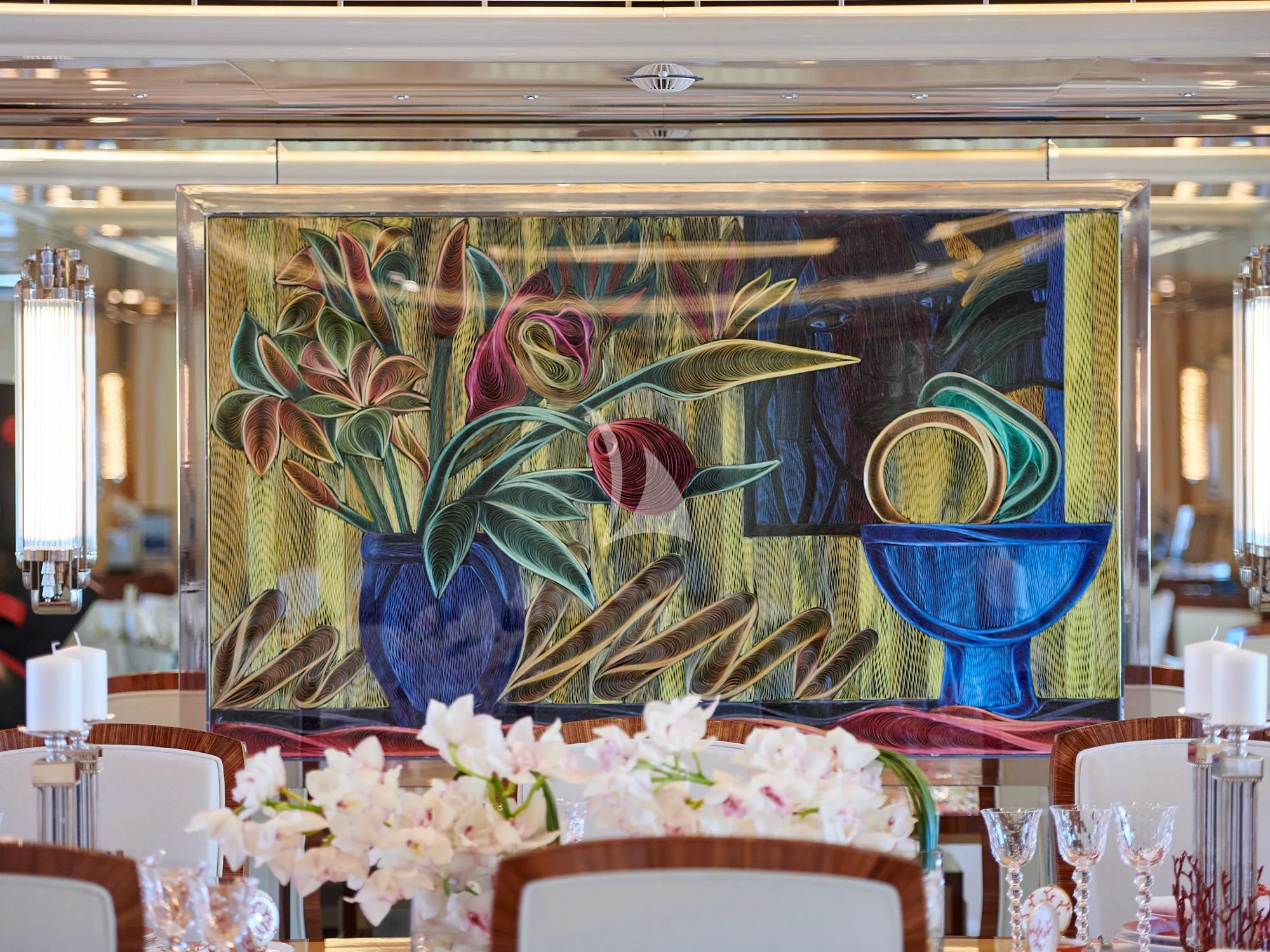 a table with a vase and flowers aboard SUNDAY Yacht for Charter