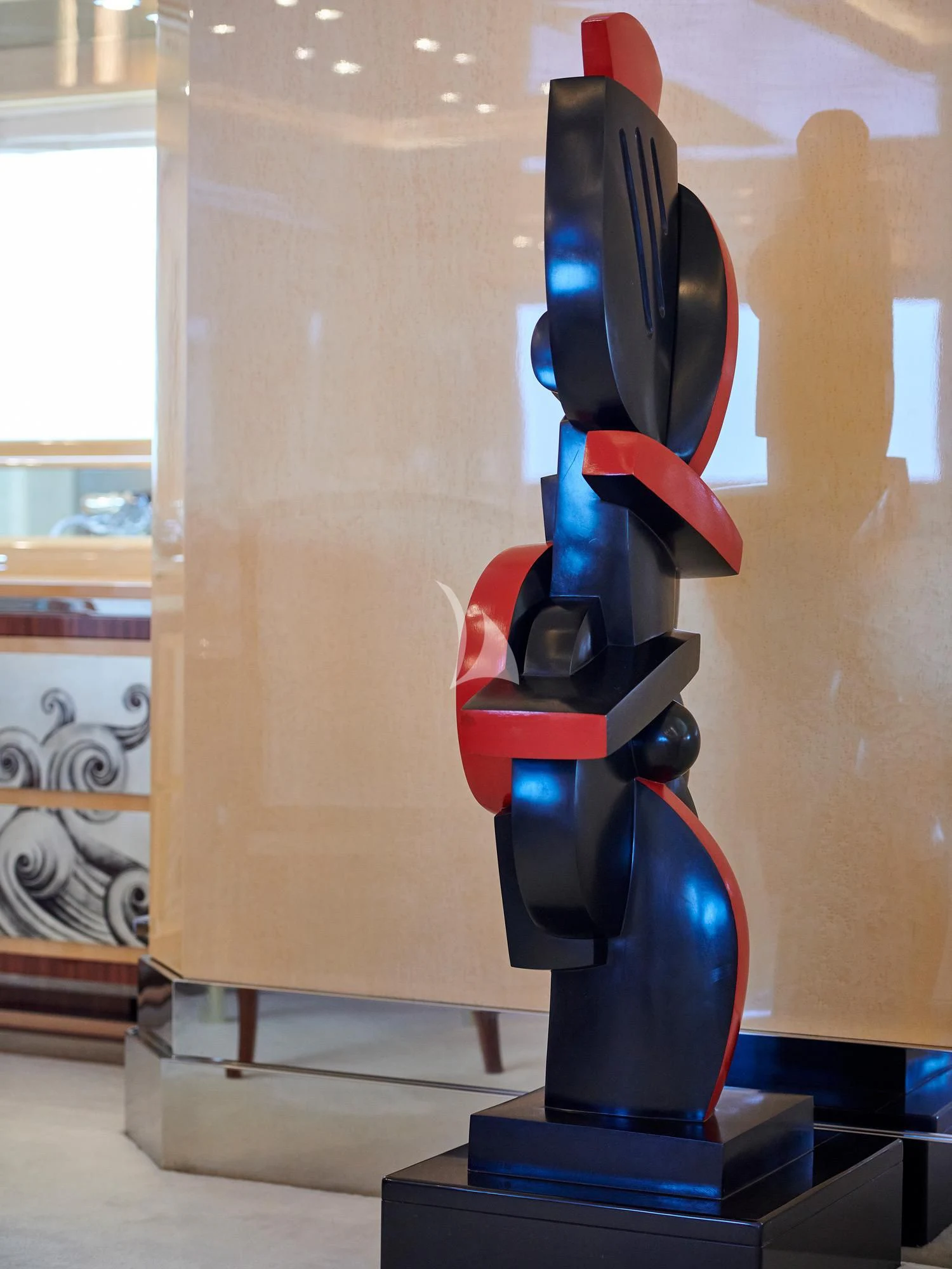 a statue of a person wearing a red and blue costume aboard SUNDAY Yacht for Charter