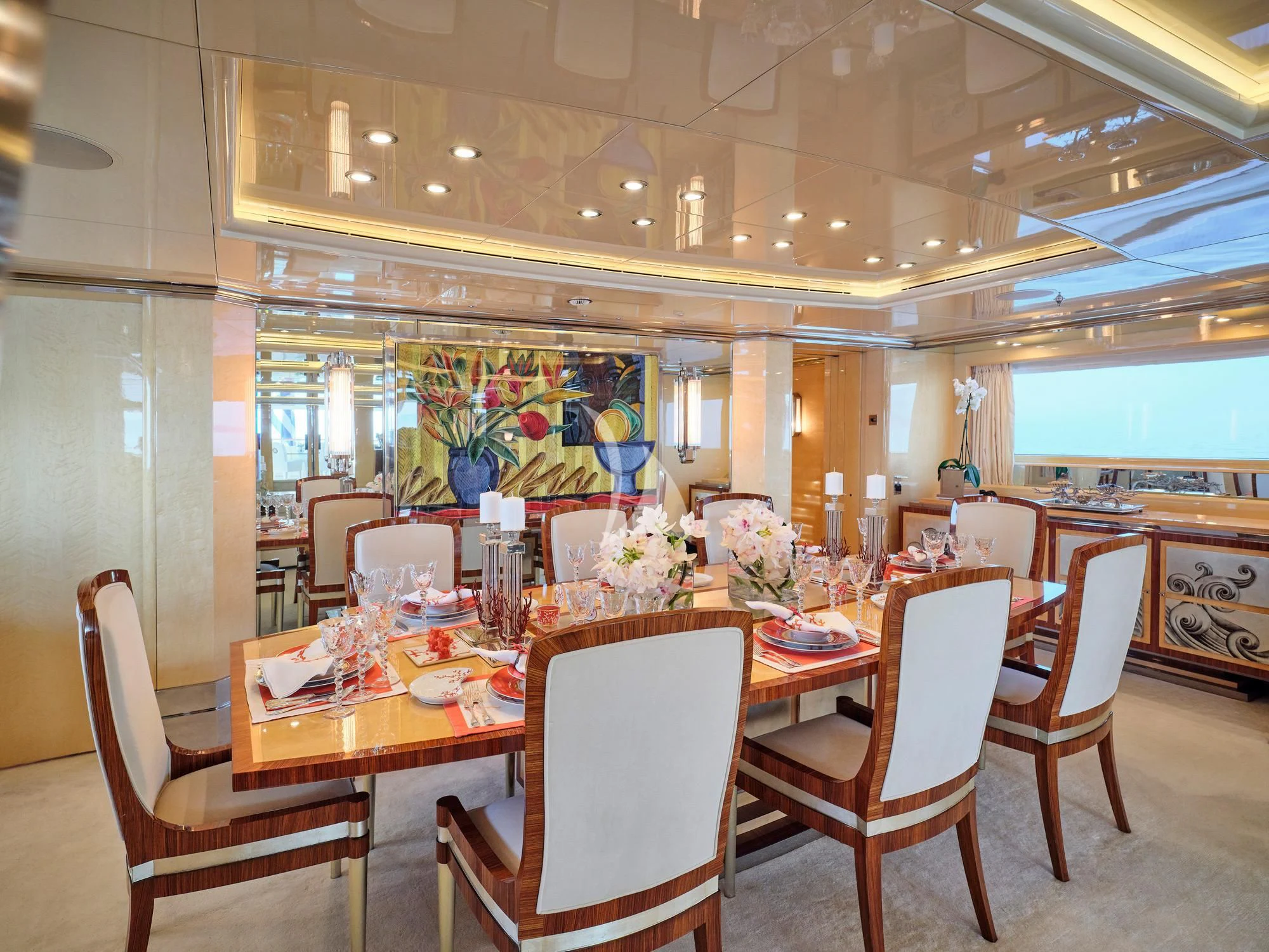 a restaurant with tables and chairs aboard SUNDAY Yacht for Charter