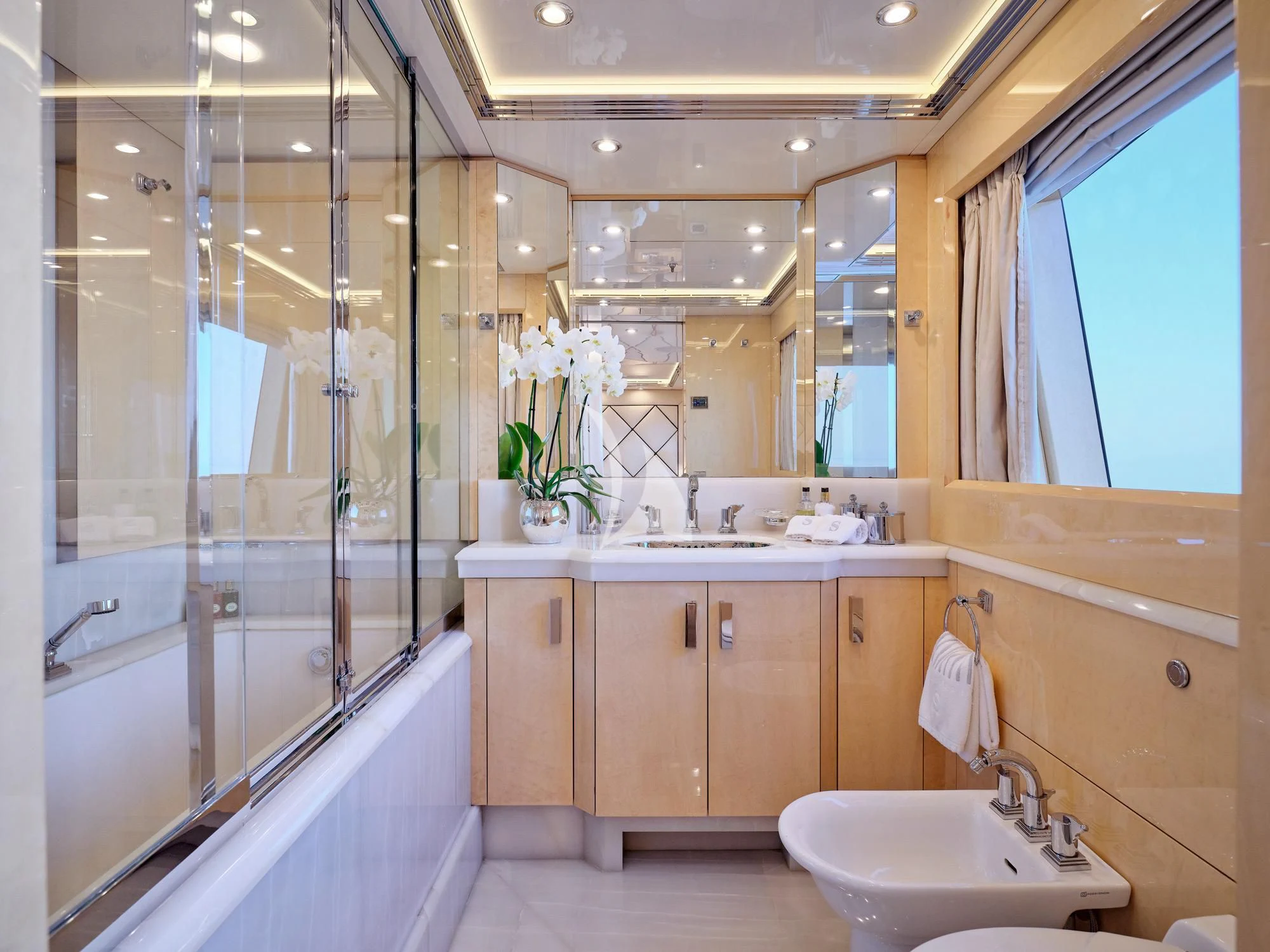 a bathroom with a sink and bathtub aboard SUNDAY Yacht for Charter