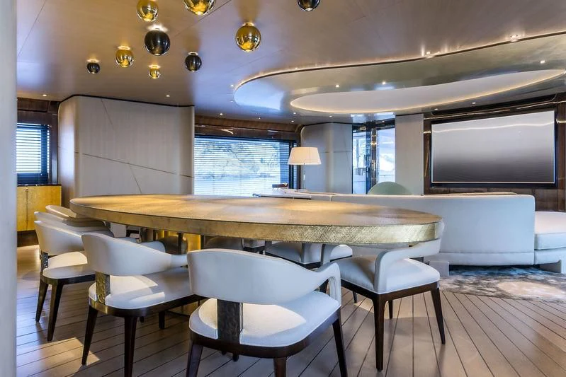 a room with a table and chairs aboard AURORA Yacht for Sale