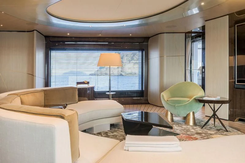 a living room with a couch and a table aboard AURORA Yacht for Sale