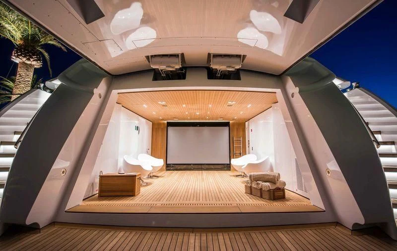 a large open room with a staircase aboard AURORA Yacht for Sale