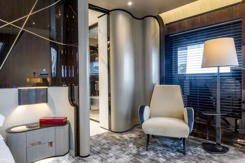 a room with a lamp and a desk aboard AURORA Yacht for Sale