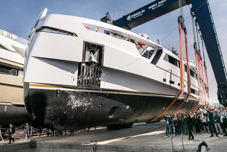 a large silver airplane with people standing around it aboard AURORA Yacht for Sale