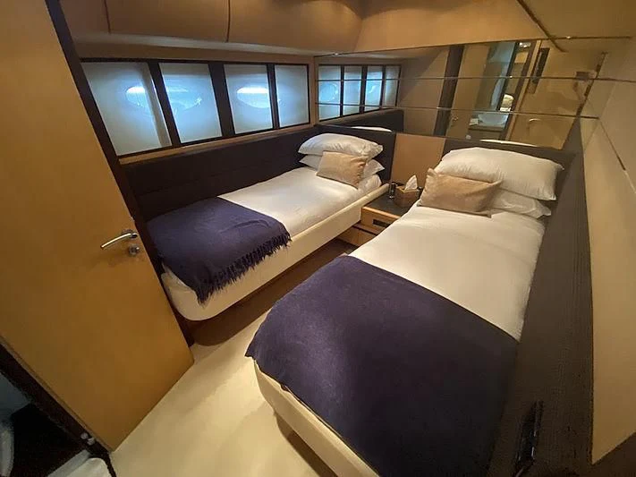 a room with two beds aboard MM Yacht for Sale