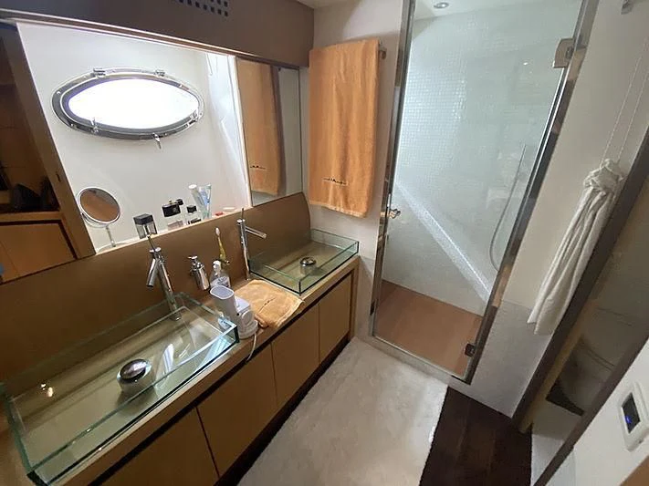 a bathroom with a large mirror aboard MM Yacht for Sale