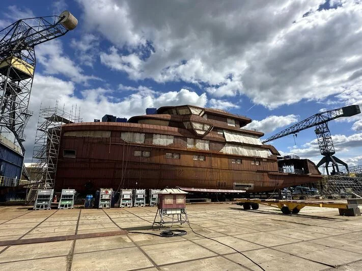 a large building with cranes aboard HORIZON II Yacht for Sale