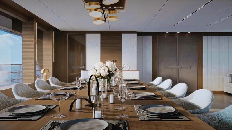 a dining room table with plates and chairs aboard HORIZON II Yacht for Sale